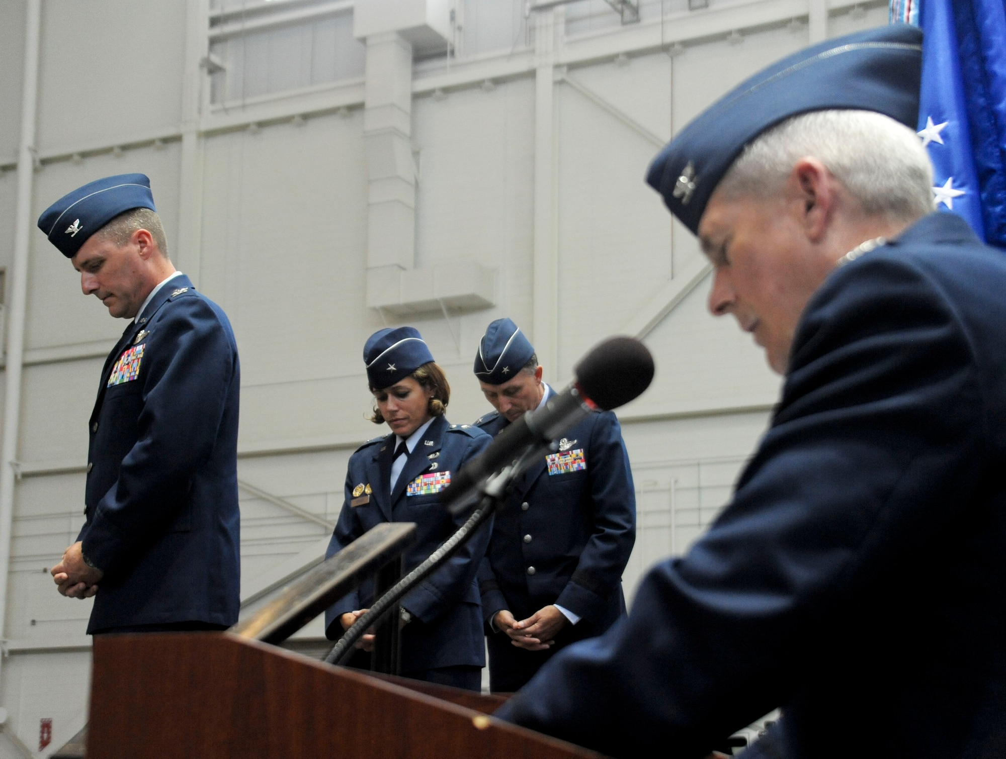 Chaplain (Col.) Timothy P. Wagner provides the invocation during the 87th Air Base Wing and Joint Base McGuire-Dix-Lakehurst change of command ceremony June 24 in Hangar 2201 at JB MDL. During the event, Brig. Gen. Gina M. Grosso relinquished command to Col. John M. Wood. (U.S. Air Force photo by 2nd Lt. David J. Murphy/Released)