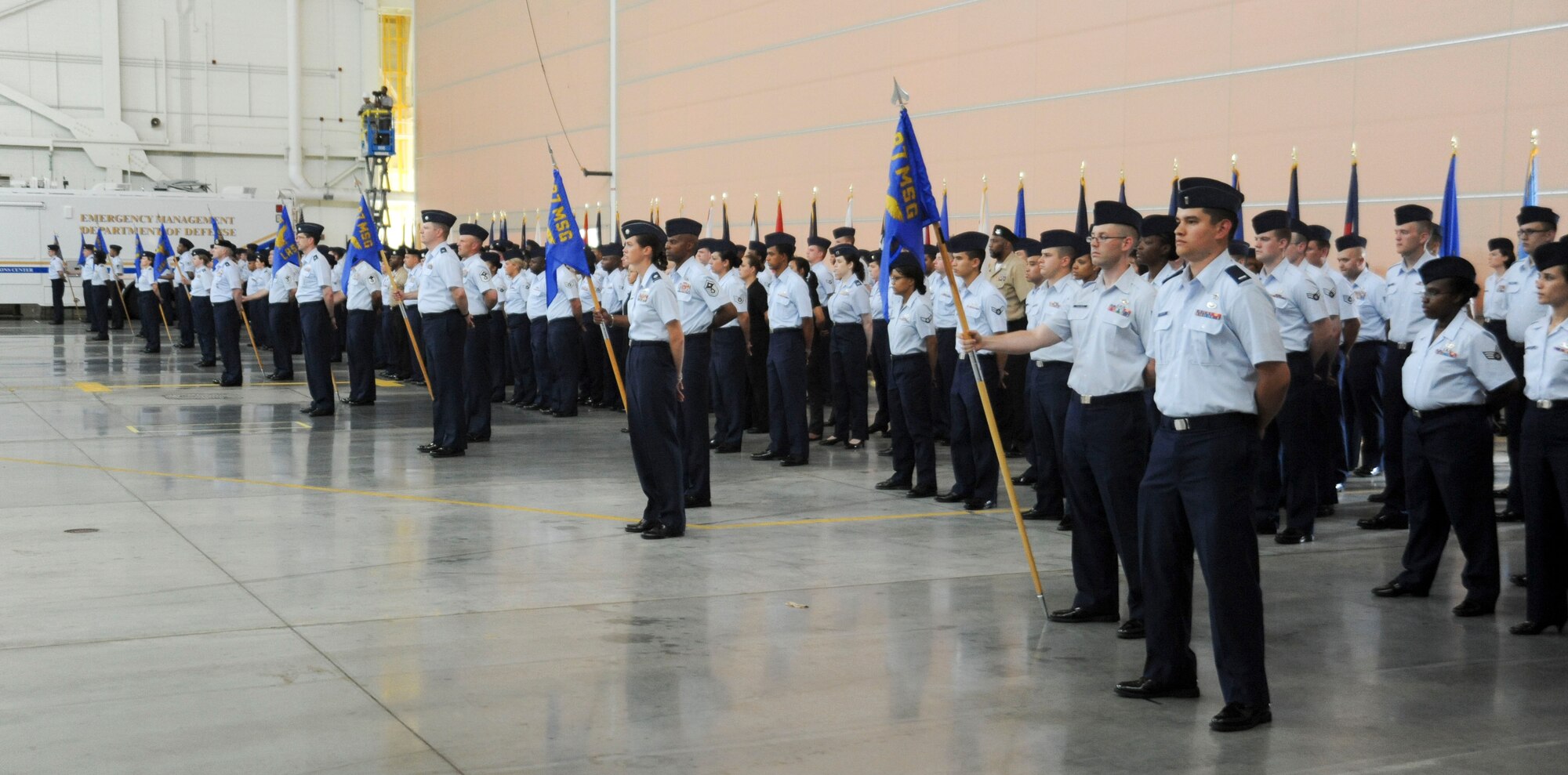 87th Air Base Wing flights stand in formation during the 87th Air Base Wing change of command ceremony June 24 in Hangar 2201 on Joint Base McGuire-Dix-Lakehurst. During the event, Brig. Gen. Gina M. Grosso relinquished command to Col. John M. Wood. (U.S. Air Force photo by 2nd Lt. David J. Murphy/Released)