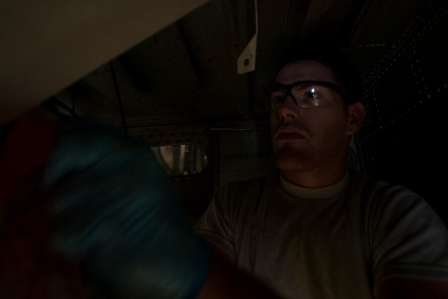 U.S. Air Force Senior Airman David Johnson, 23rd Component Maintenance Squadron hydraulic inspection specialist, loosens the hydraulic system of an HC-130P Combat King before replacing old filters during a 550-day inspection at Moody Air Force Base, Ga., June 20 2011. Airman Johnson has to follow specific guidelines during the inspection to make sure nothing gets overlooked. (U.S. Air Force photo by Airman 1st Class Joshua Green/Released)  