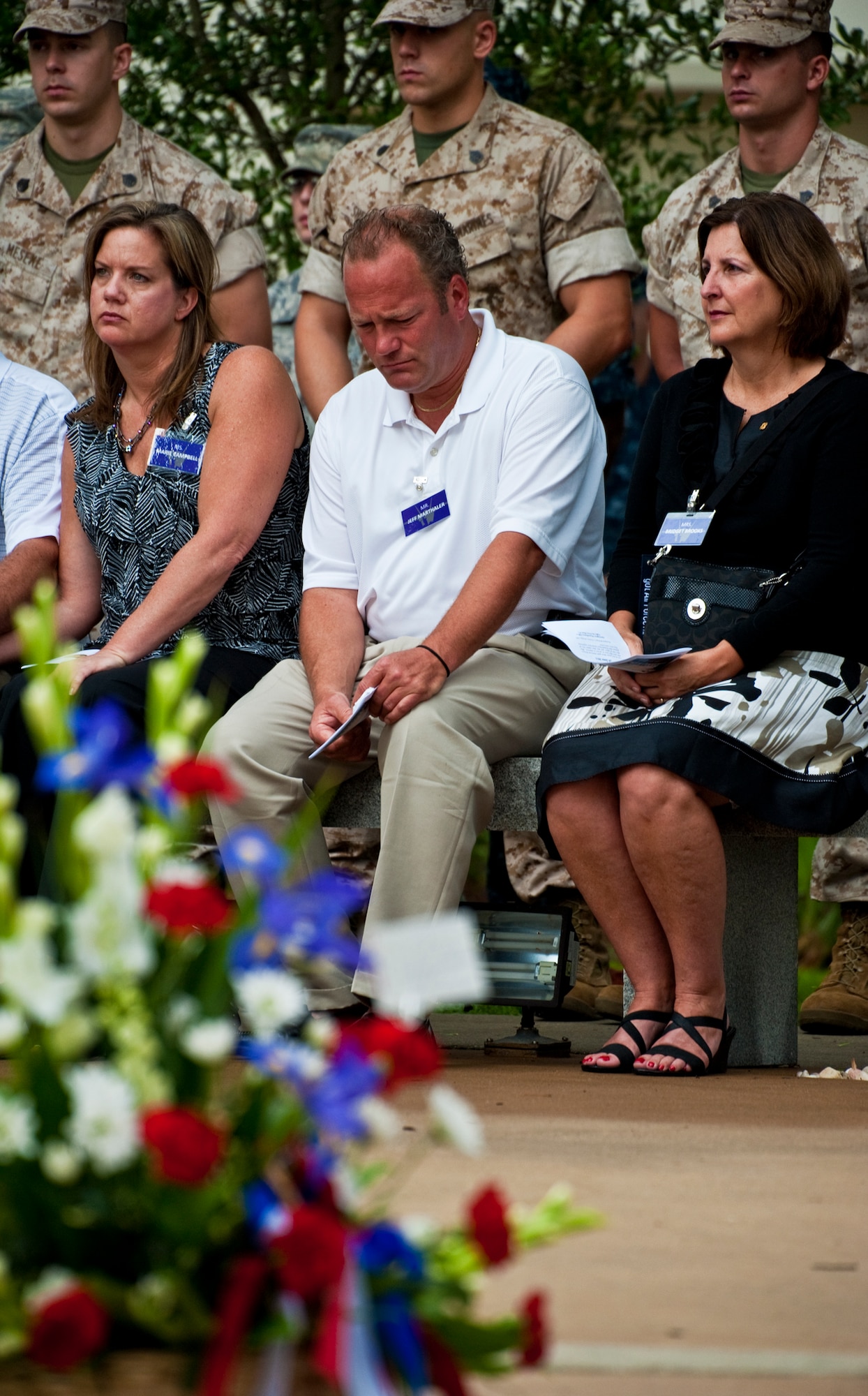 Jeff Marthaler, uncle of Airman 1st Class Brent Marthaler, and Bridget Brooks, mother of Airman 1st Class Joseph Rimkus, observe a moment of silence at the Khobar Towers Memorial ceremony June 24 at Eglin Air Force Base, Fla.  June 25 marks the 15th anniversary of the tragic bombing that killed 19 service members including 12 33rd FW Airmen.  Each year, a ceremony is held by the Nomads to commemorate their brothers who’ve “ceased their wandering.”  (U.S. Air Force photo/Samuel King Jr.)