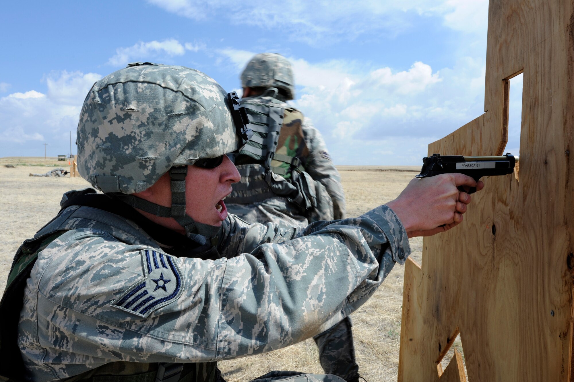 Staff Sgt. Richard Nash provides cover while running the Shoot, Move and Communicate course June 15, 2011, at Schriever Air Force Base, Colo. The security forces specialists train on this course to maintain proficiency in tactical maneuvers.Sergeant Nash is a member of the 50th Security Forces Squadron. (U.S. Air Force photo/David Ahlschwede)
