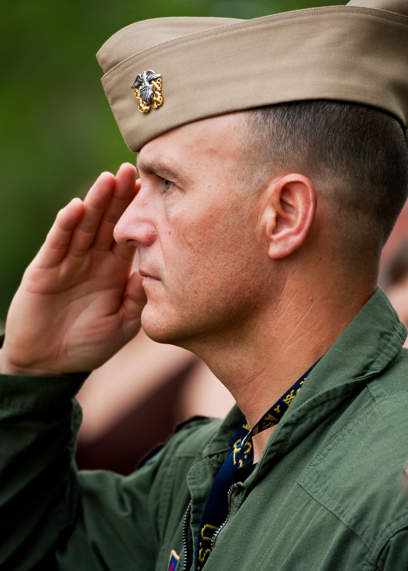 Navy Capt. Michael Saunders, 33rd Operations Group commander, salutes during the National Anthem at the Khobar Towers Memorial ceremony June 24 at Eglin Air Force Base, Fla.  June 25 marks the 15th anniversary of the tragic bombing that killed 19 service members including 12 33rd FW Airmen.  Each year, a ceremony is held by the Nomads to commemorate their brothers who’ve “ceased their wandering.”  (U.S. Air Force photo/Samuel King Jr.)