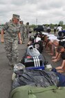 YOUNGSTOWN AIR RESERVE STATION, Ohio -- Air Force Reserve Senior Airman Kalee Link, a personnel specialist with the 910th Maintenance Group, closely watches Air Force Junior Reserve Officer Training Corps (AFJROTC) cadets demonstrates push-ups during the annual encampment here June 22.   The 910th Airlift Wing here is hosting approximately 50 JROTC cadets from Ohio high schools for a 5-day encampment June 22-26. The cadets are ninth through 12th grade students at John Marshall and East Technical High Schools in Cleveland; Green High School in Uniontown; and Trumbull Career and Technical Center in Warren. Approximately 19 Youngstown Air Reserve Station Sailors, Marines and Airmen volunteered to teach the youth leadership, teamwork, respect for others, and the Air Force core values through mentorship training, workshops, physical fitness, and drill and ceremony exercises.   The encampment concludes June 26 with a graduation ceremony. U.S. Air Force photo by Maj. Brent J. Davis