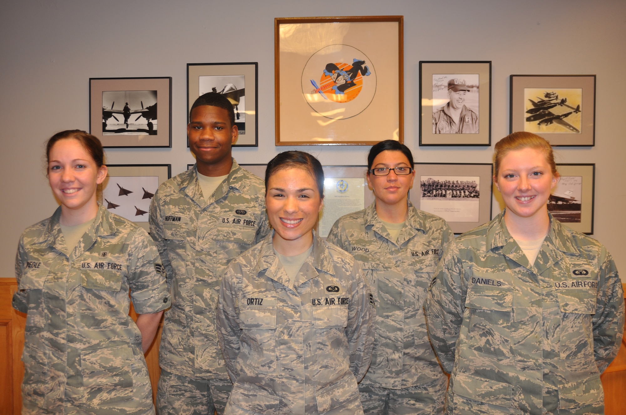 The Airman Activity Council’s executive committee: Senior Airman Michaela Spiegle, Airman’s Activity Council Programs Coordinator, Airman 1st Class Perry Huffman, AAC President, Senior Airman Christina Ortiz, AAC Vice President, Senior Airman Brooke Wood, AAC Treasurer and Airman 1st Class Dustie Daniels, AAC Secretary, pose together. (U.S. Air Force photo/Sonic Johnson)
