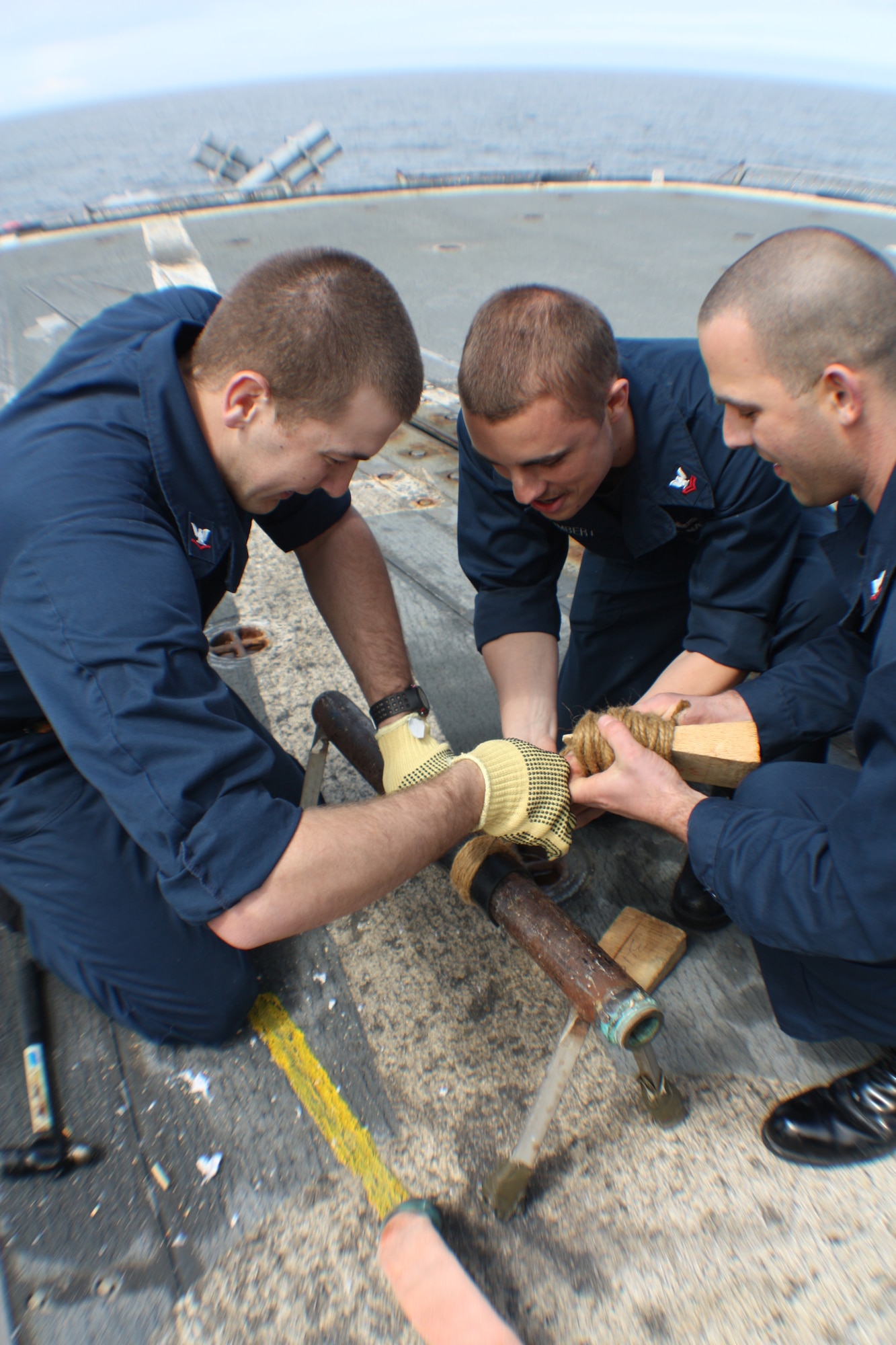 GULF OF ALASKA -- A pipe patching team races to seal a rupture in a pipe during the Damage Control Olympics aboard the guided-  cruiser USS Lake Erie (CG 70) June 19, 2011, in the Gulf of Alaska during Northern Edge 11. (U.S. Navy photo/Petty Officer 3rd Class Matthew Rodriguez)





