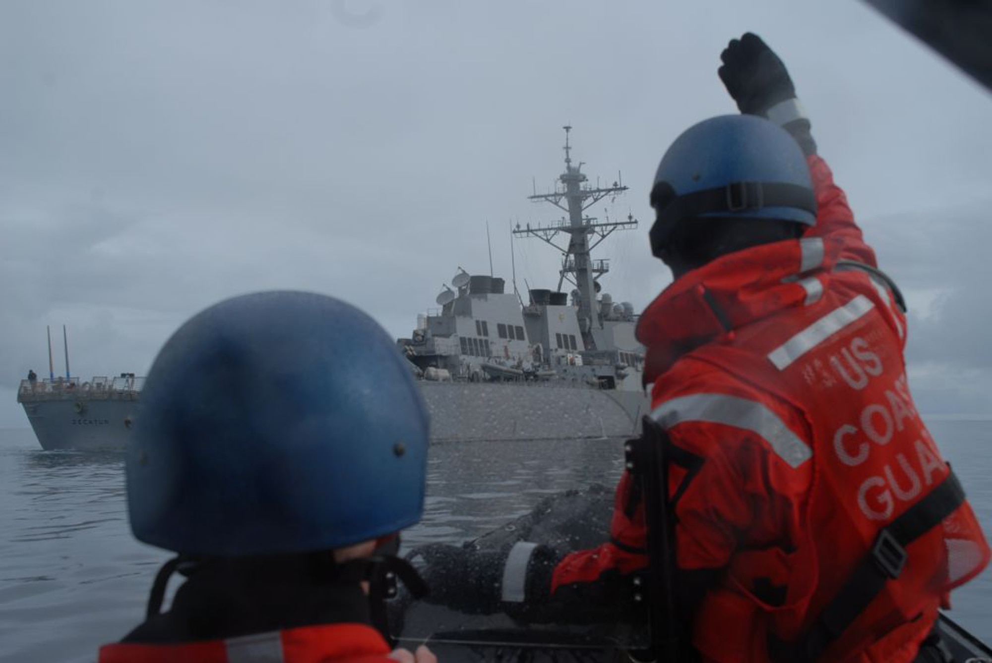 GULF OF ALASKA -- Members from the Coast Guard Cutter Bertholf complete a small-boat transfer with the USS Decatur (DDG-73) June 17, 2011, in the Gulf of Alaska during Northern Edge 11. (Photo courtesy of U.S. Coast Guard)



