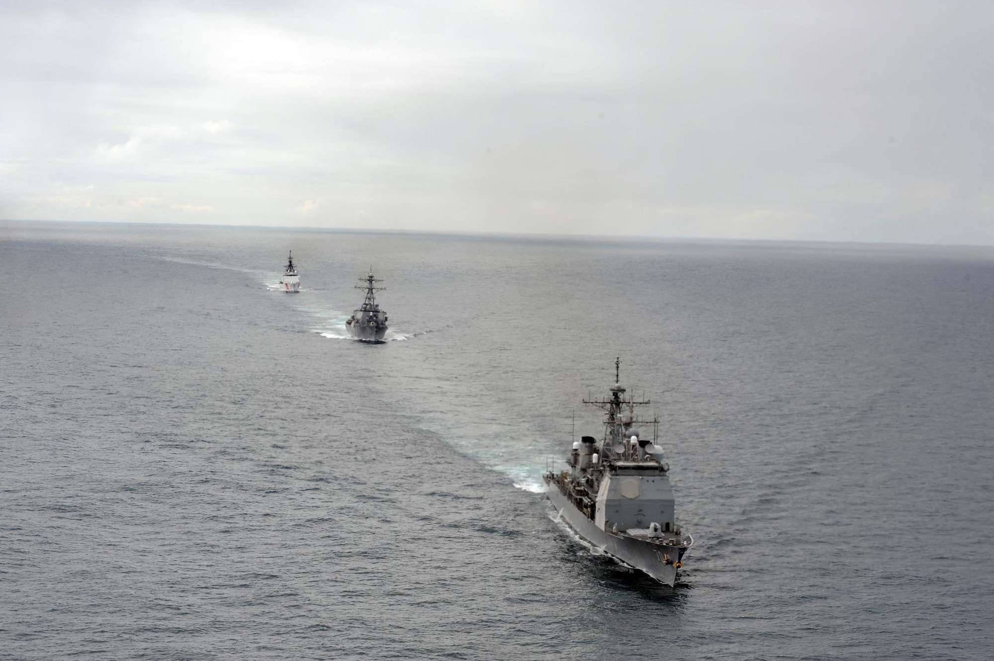 KODIAK, Alaska - The USS Lake Erie, front, an Aegis-class guided missle-cruiser homeported in Pearl Harbor and the USS Decatur, an Arleigh Burke-class guided-missle destroyer homeported in San Diego and the Coast Guard Cutter Bertholf, a national security cutter homeported in Alameda, Calif., transit the Gulf of Alaska in formation June 17, 2011, during Northern Edge 11. (Photo by Coast Guard Petty Officer 3rd Class Charly Hengen)




