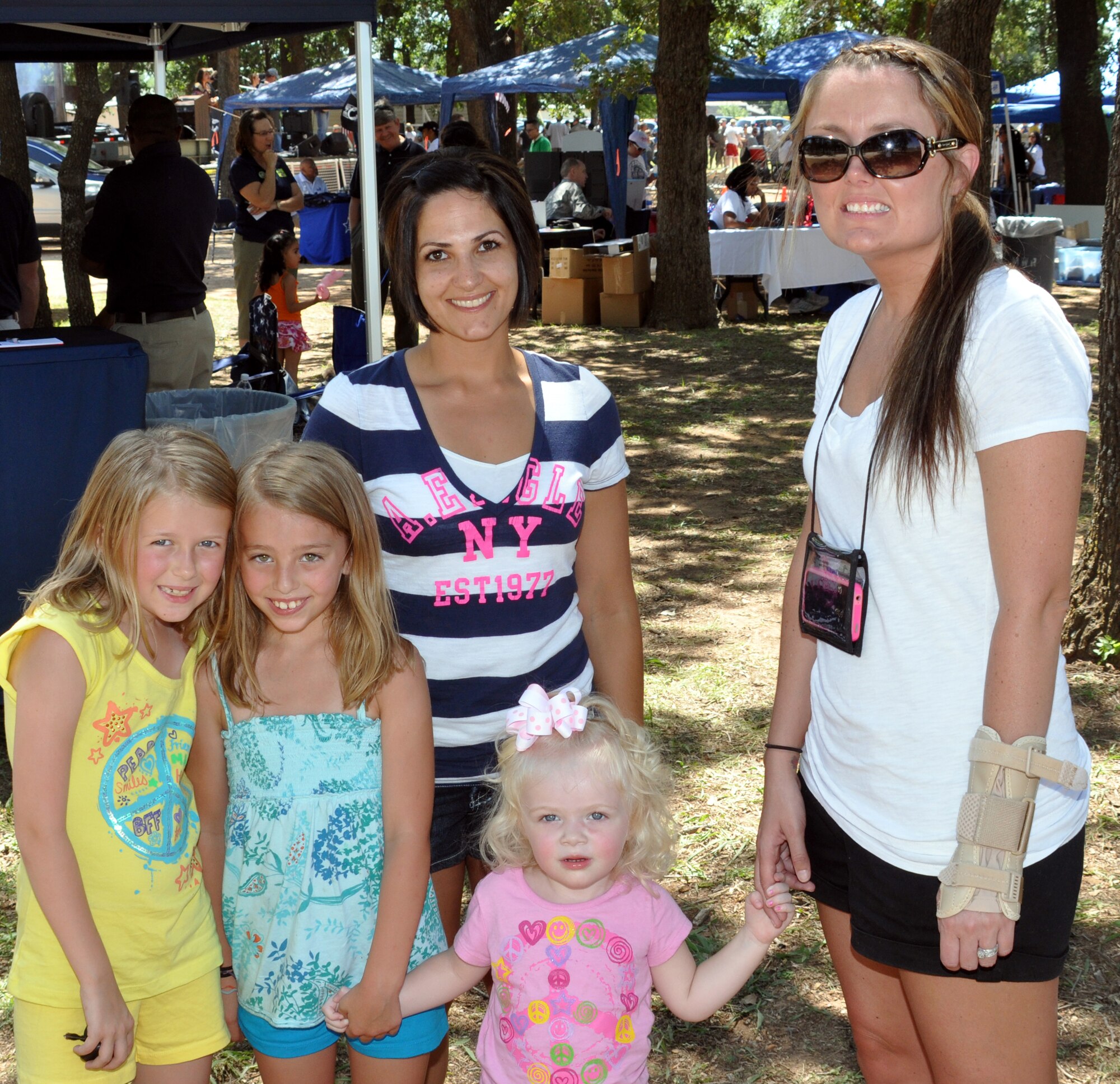 Staff Sgt. Bonnie Rios, 301st Force Support Squadron, right, Senior Airman Stephanie Miller, 301st Logistics Readiness Squadron, Hailey Rios, Vanessa Antoney, and Payton Rios attended the 301st  Fighter Wing Family Day June 4.  (U.S. Air Force photo/Staff Sgt. Chris Bolen)