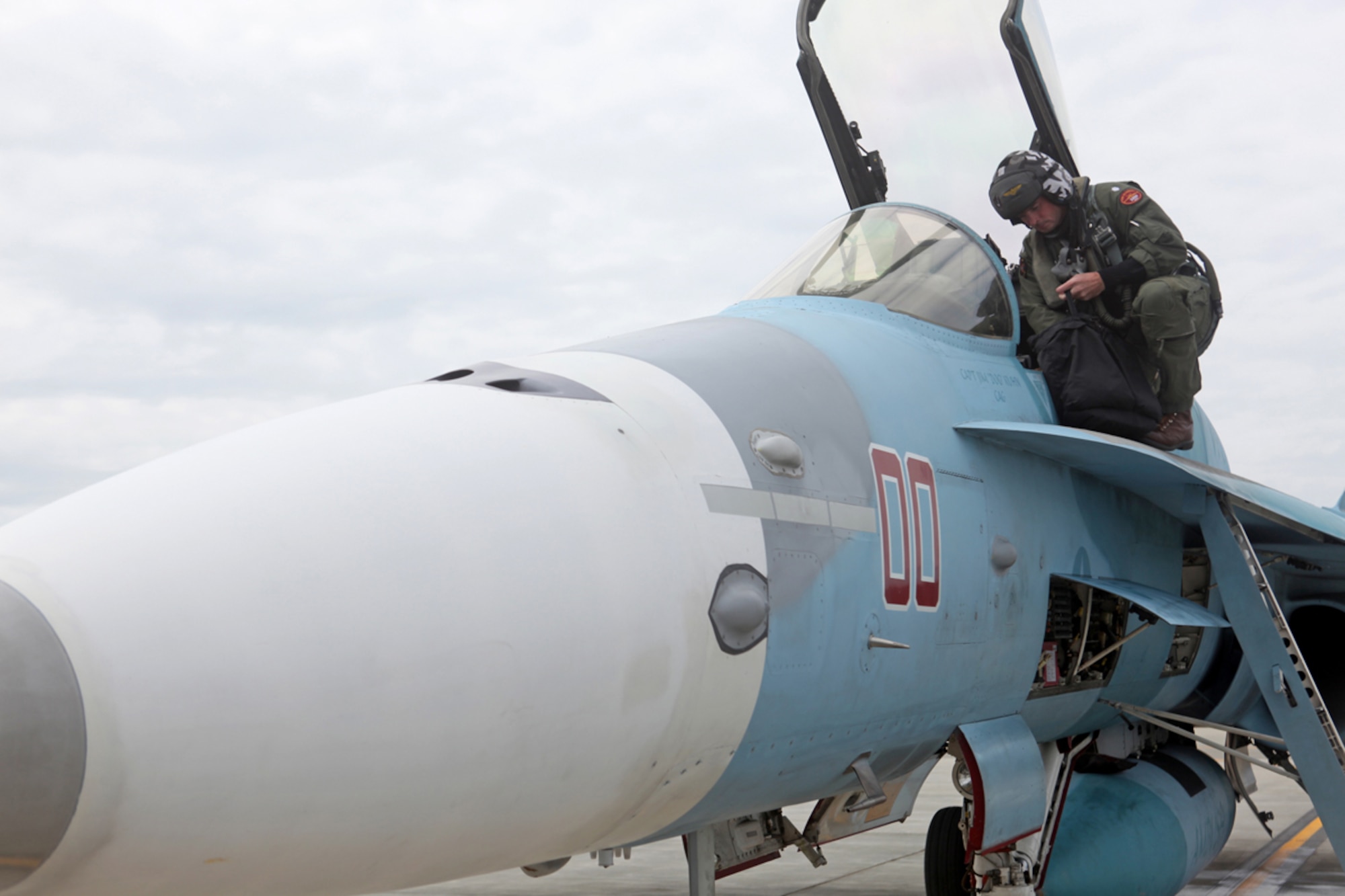 JOINT BASE ELMENDORF-RICHARDSON, Alaska -- Navy aggressor pilot Cmdr. Elliot Clemence of Fighter Squadron Composite-12 returns from aerial combat simulation during Exercise Northern Edge June 22, 2011, at Joint Base Elmendorf-Richardson, Alaska. (U.S. Marine Corps photo/Cpl. Marionne T. Mangrum)
