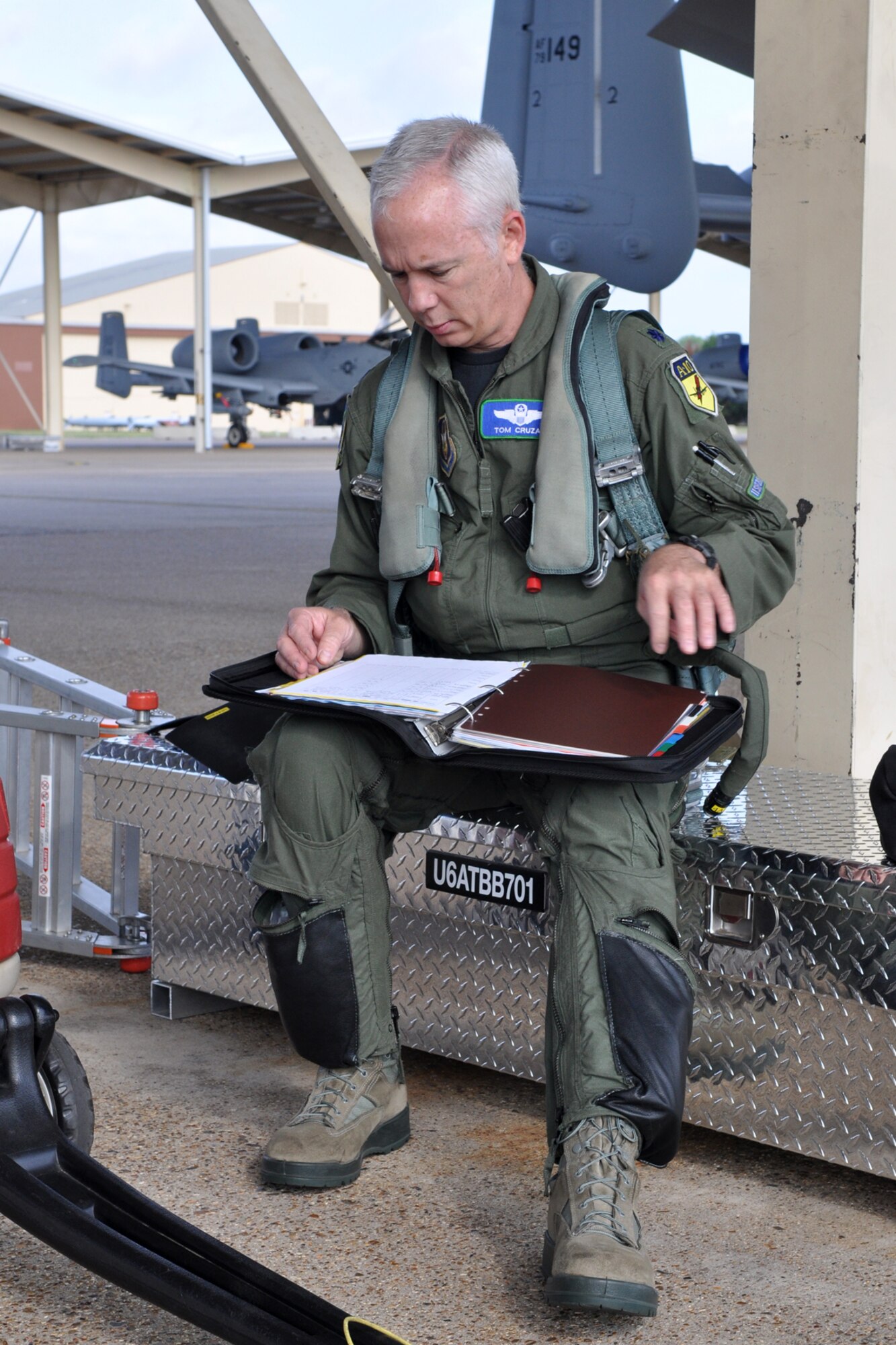 Lt. Col. Tom Cruzan, assistant director of operations, 47th Fighter Squadron, checks paperwork before performing a pre-flight inspection on an A-10 Thunderbolt II, in preparation for a sortie at Barksdale Air Force Base, La., June 15, 2011. Colonel Cruzan’s sortie was to Claiborne Bombing and Gunnery Range near Alexandria, La., where he dropped BDU-33 practice bombs on targets. (U.S. Air Force photo/Tech. Sgt. Jeff Walston)