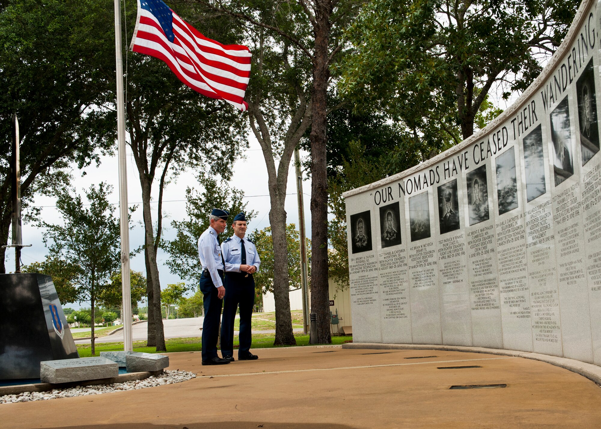 Air Force Chief of Staff Gen. Norton Schwartz and Col. Andrew Toth, 33rd Fighter Wing commander, visit the Khobar Towers Memorial Wall two days prior to the 15th anniversary of the tragedy during a tour of the 33rd FW June 23, 2011, at Eglin Air Force Base, Fla.  Nineteen Airmen—12 of whom were members of the 33rd FW—lost their lives in the bombing June 25, 1996.  During a visit to Eglin, the general also visited the first F-35 squadron, the 58th Fighter Squadron, and the JSF Academic Training Center.  (U.S. Air Force photo/Samuel King Jr.)