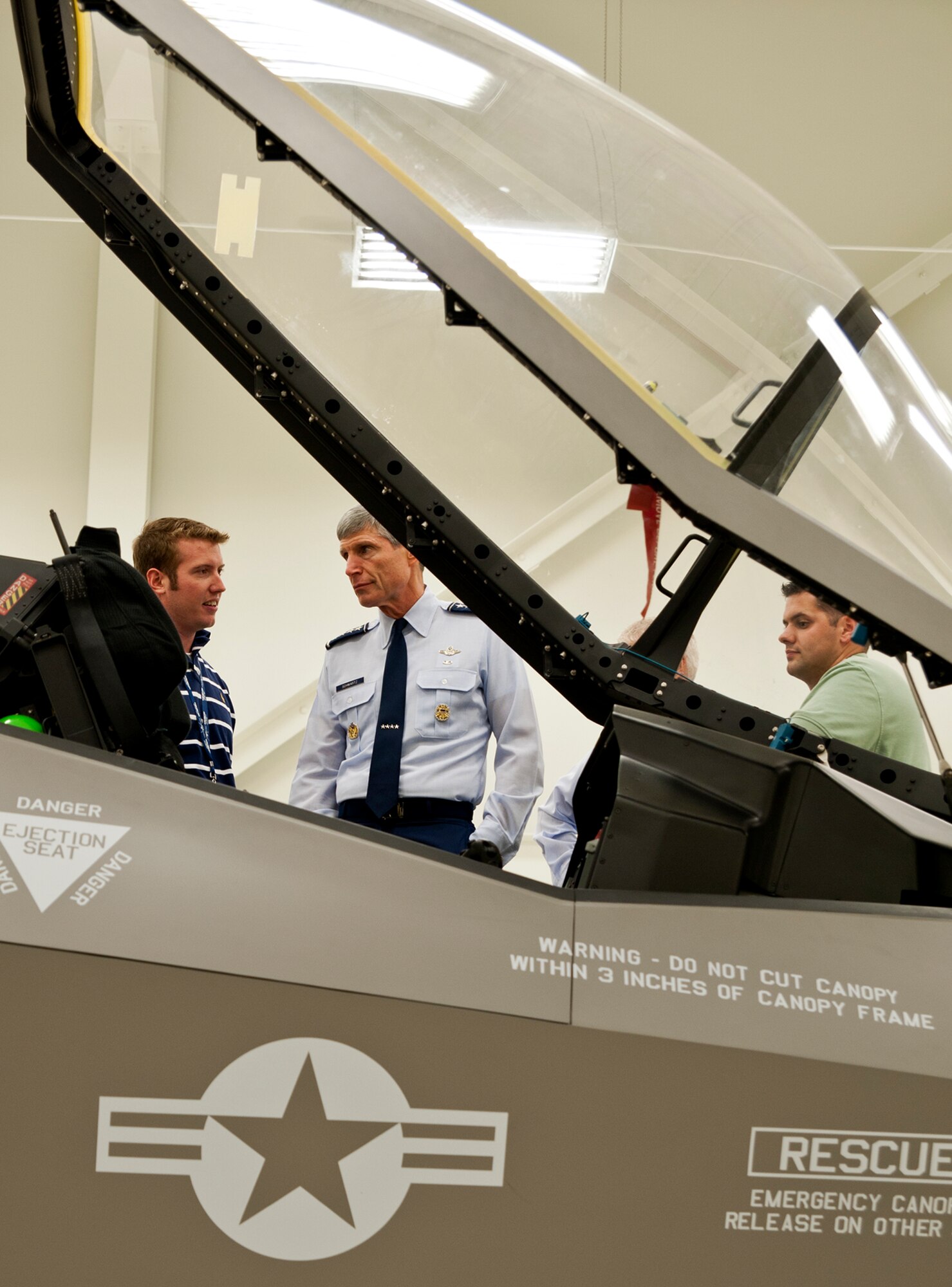 Air Force Chief of Staff Gen. Norton Schwartz (middle) learns about the new improvements within the cockpit of the F-35 Joint Strike Fighter June 23, 2011, at Eglin Air Force Base, Fla.  The general visited the Khobar Towers memorial, 58th Fighter Squadron and the JSF Academic Training Center during his tour of the F-35’s new home, the 33rd Fighter Wing.  The 33rd FW is a joint graduate flying and maintenance training wing for the F-35A, B, and C.  (U.S. Air Force photo/Samuel King Jr.)
