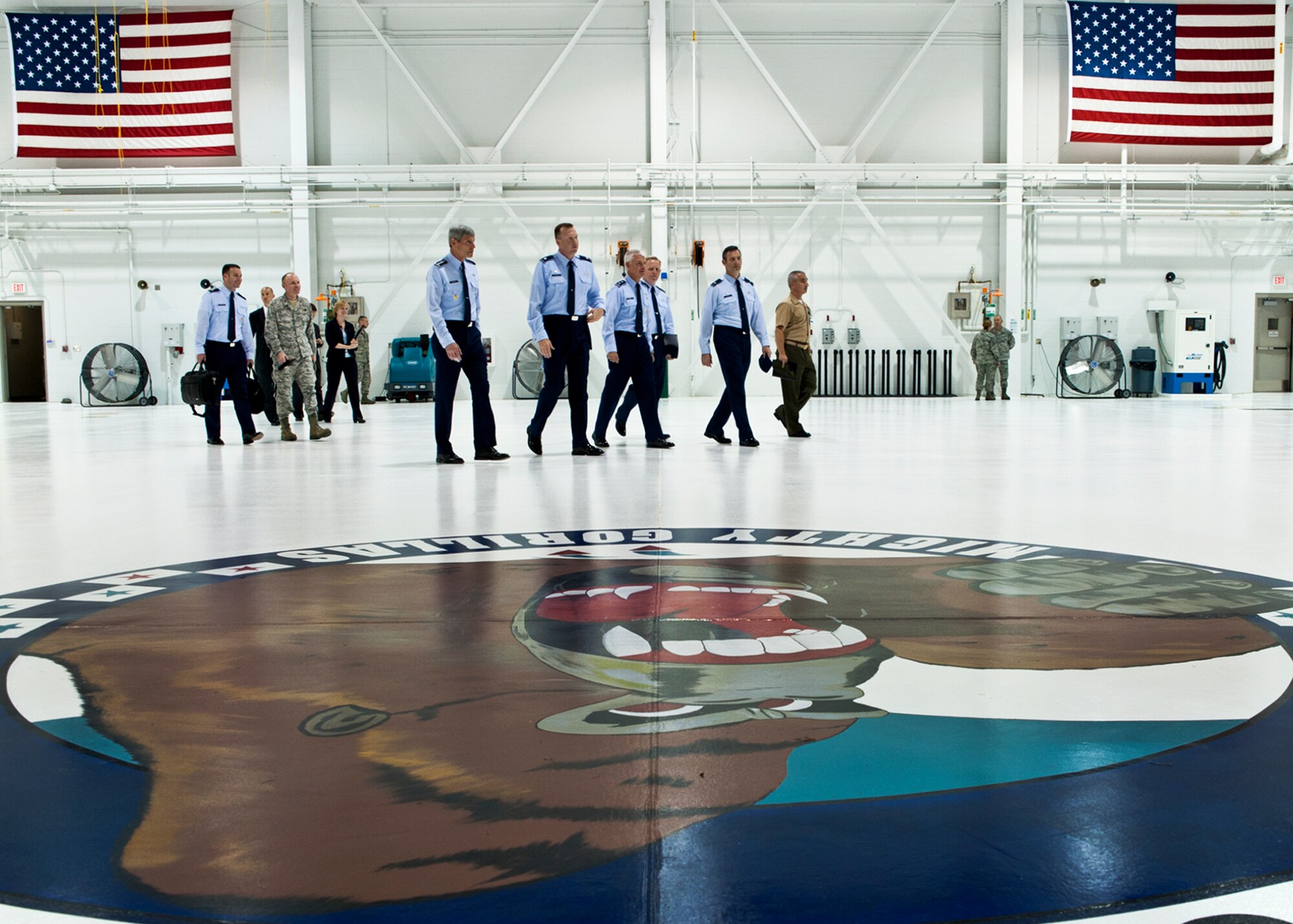 Air Force Chief of Staff Gen. Norton Schwartz and others pass through the maintenance hangar of the 58th Fighter Squadron “Mighty Gorillas” during a tour of the 33rd Fighter Wing June 23, 2011, at Eglin Air Force Base, Fla.  During a visit to Eglin, the general visited the Khobar Towers memorial, the JSF Academic Training Center and presented a Bronze Star during his time at Eglin.  (U.S. Air Force photo/Samuel King Jr.)