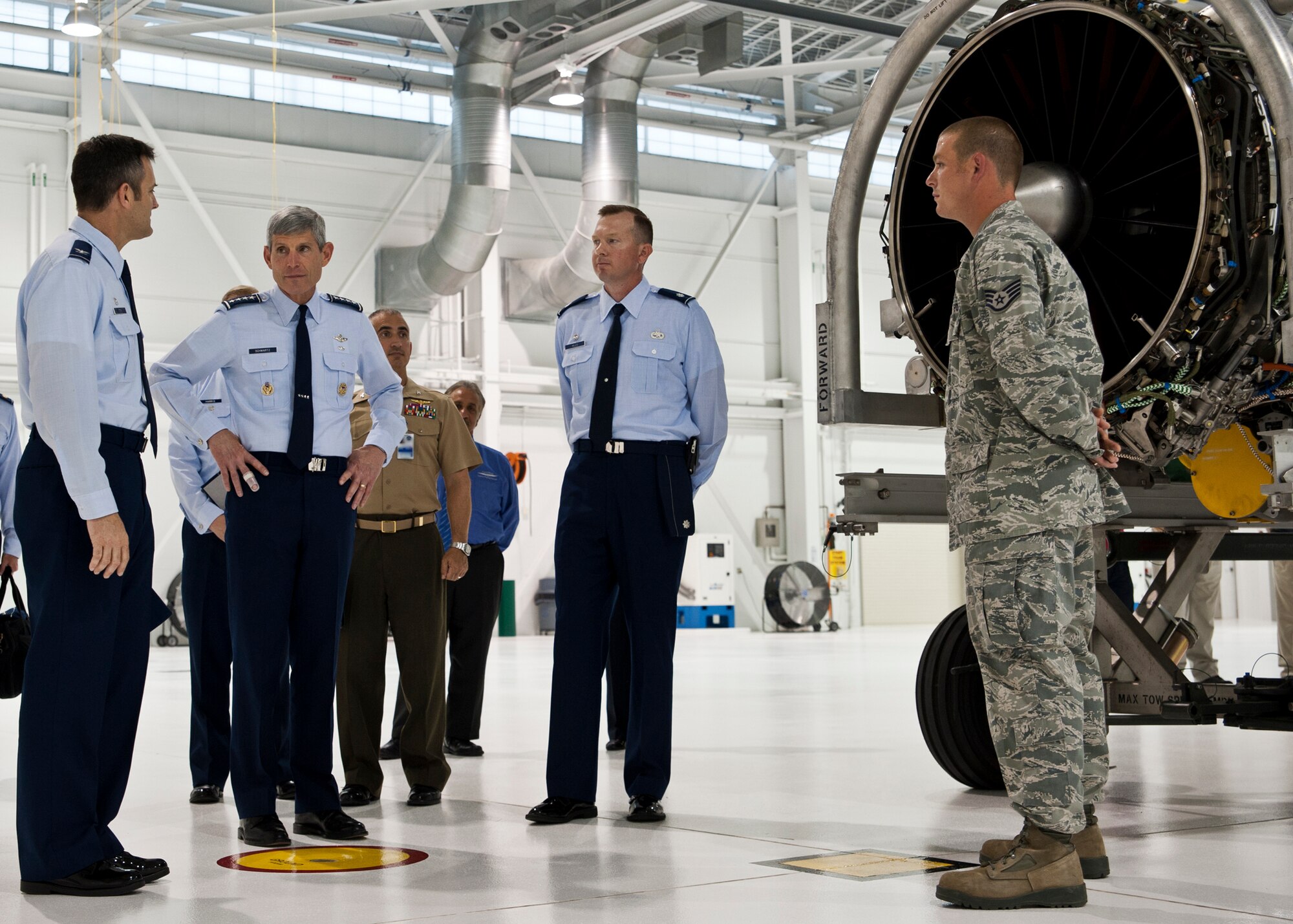 Air Force Chief of Staff Gen. Norton Schwartz (second from left) talks with Col. Andrew Toth, 33rd Fighter Wing commander (far left); Lt. Col. Michael Miles, 58th Aircraft Maintenance Squadron commander (second from right) and Staff Sgt. Michael Sanders, 58th AMXS (far right), about the Pratt and Whitney F-135 engine during a tour of the 33rd FW June 23, 2011, at Eglin Air Force Base, Fla.  The F-135 is the engine used in the Air Force variant of the Joint Strike Fighter.  The 33rd FW is a joint graduate flying and maintenance training wing for the F-35A, B, and C.  During a visit to Eglin, the general visited the Khobar Towers memorial, 58th Fighter Squadron and the JSF Academic Training Center.  (U.S. Air Force photo/Samuel King Jr.)
