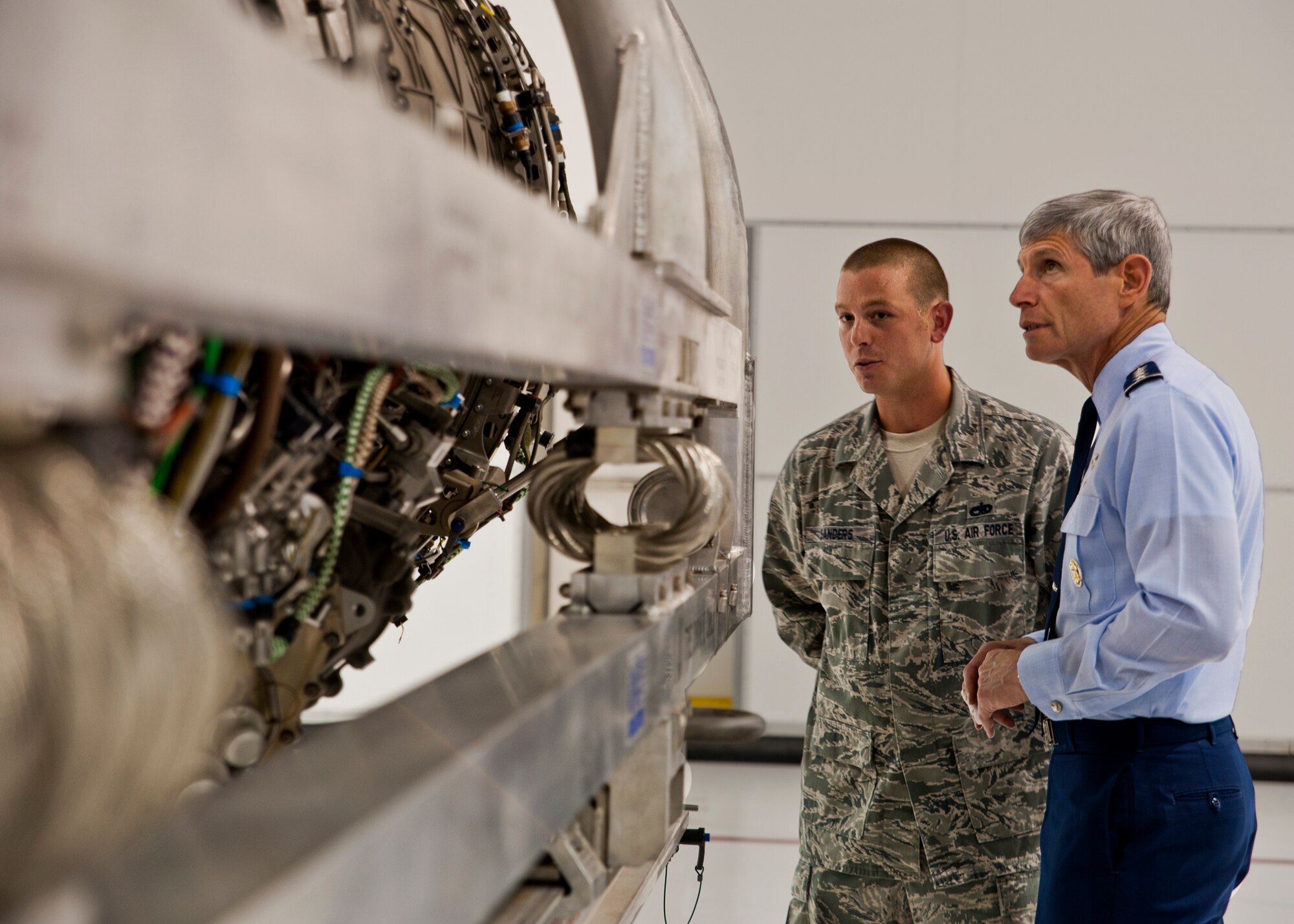 Air Force Chief of Staff Gen. Norton Schwartz and Staff Sgt. Michael Sanders, 58th Aircraft Maintenance Squadron, discuss the Pratt and Whitney F-135 engine during a tour of the 33rd Fighter Wing June 23, 2011, at Eglin Air Force Base, Fla.  The F-135 is the engine used in the Air Force variant of the Joint Strike Fighter.  The 33rd FW is a joint graduate flying and maintenance training wing for the F-35A, B, and C. During a visit to Eglin, the general visited the Khobar Towers memorial, 58th Fighter Squadron and the JSF Academic Training Center.  (U.S. Air Force photo/Samuel King Jr.)