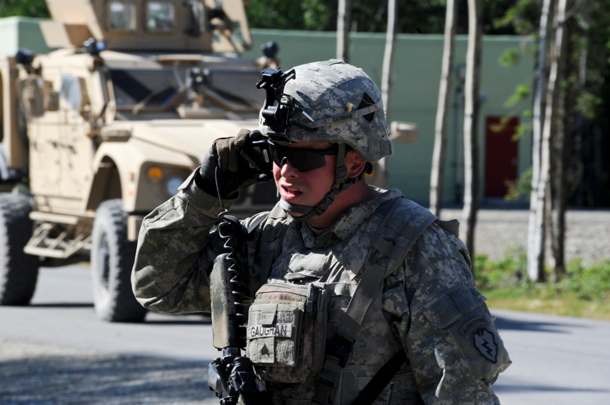 JOINT BASE ELMENDORF-RICHARDSON, Alaska ???- Sgt. Logan Gaughan,1st Battalion (Airborne), 501st Infantry Regiment, listens to his radio during an urban operations training exercise at Donnelly Training Area, June 7. Urban operations training allows for Soldiers to practice many different potential scenarios they could encounter while deployed.  (U.S. Air Force photo/ Airman 1st Class Jack Sanders)