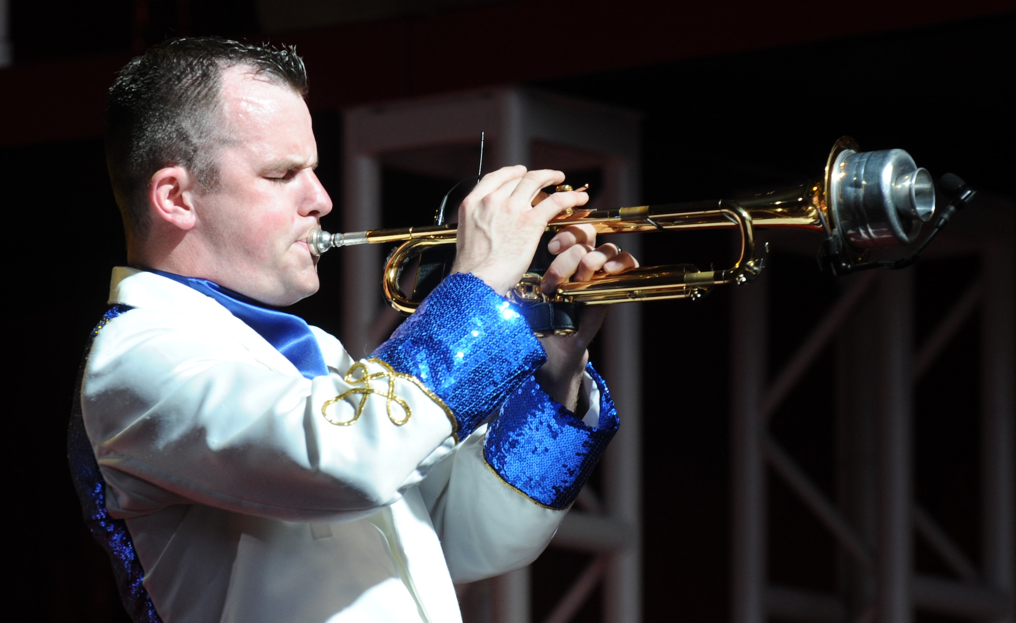 MOUNTAIN HOME AIR FORCE BASE, Idaho – Senior Airman James Santos, 62nd Maintenance Squadron precision measurement equipment journeyman, plays his trumpet during a Tops in Blue performance in hangar 1331, June 18. Each year, Air Force personnel stationed world-wide compete in a multilevel competition for the chance to be selected as a member of this organization. (U.S. Air Force photo by Senior Airman Debbie Lockhart)