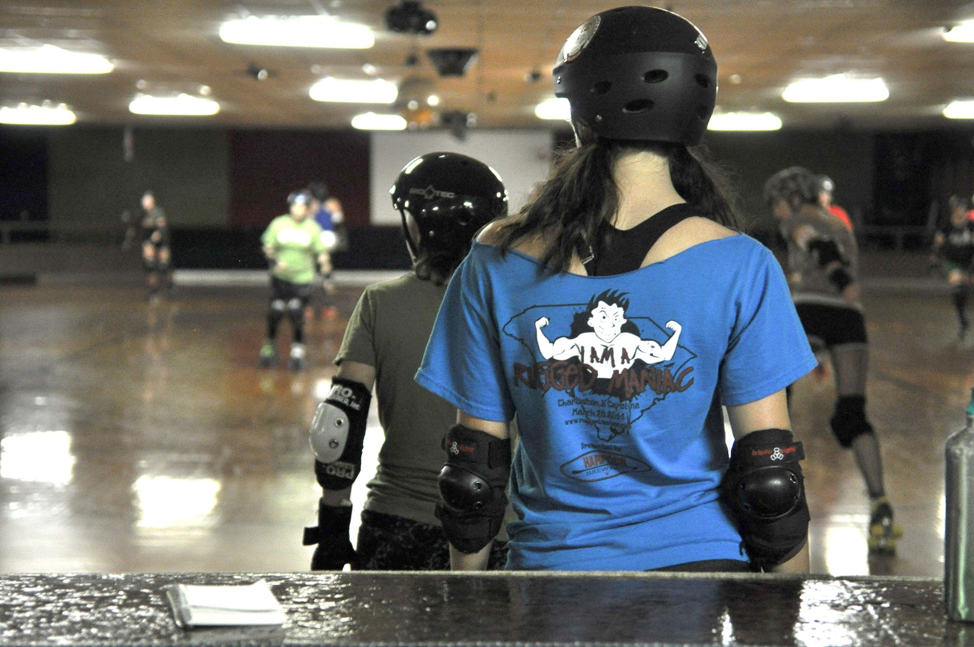 Capt. Molly Sanford is a mild-mannered C-17 pilot with the 300th Airlift Squadron.  But as Molly Mauls-A-Lot, she’s a fast-skating, hard-charging roller derby jammer ready to take on any bout thrown her way. (U.S. Air Force Photo by Master Sgt. Mary Hinson) 
