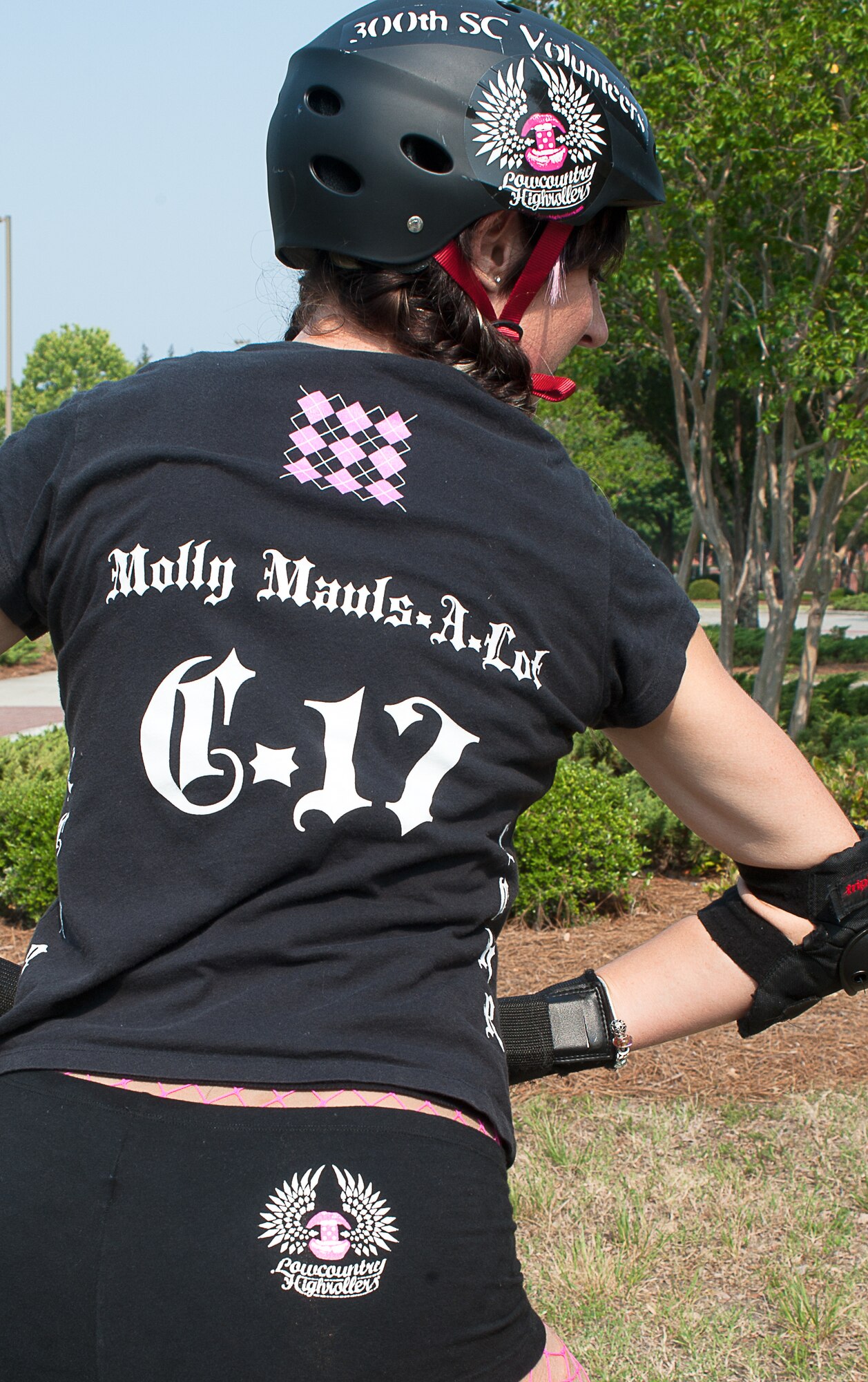 Capt. Molly Sanford is a mild-mannered C-17 pilot with the 300th Airlift Squadron.  But as Molly Mauls-A-Lot, she’s a fast-skating, hard-charging roller derby jammer ready to take on any bout thrown her way. (U.S. Air Force Photo by Master Sgt. Mary Hinson) 
