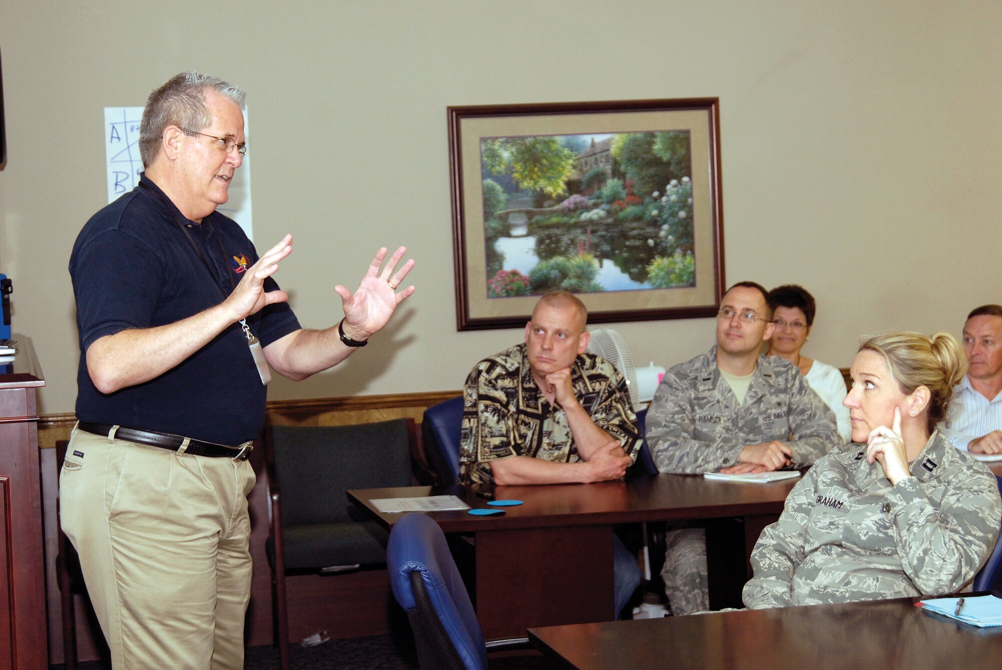 Paul Savage, an OSHA and DOD specialist with years of Voluntary Protection Program success stories to his credit, briefed VPP concepts to Tinker’s management and stressed their importance to VPP’s success, or failure. With a thick Texas drawl peppered with Forrest Gump-isms, humor, a non-stop list of success stories and a visible passion for workforce safety, Mr. Savage talked with a 72nd Air Base Wing leadership group here June 16. (Air Force photo by Margo Wright)