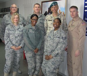 Senior Airman Melissa Benifield (center), a 633d Surgical Operations Squadron medical technician, is currently deployed to the Transit Center at Manas, Kyrgyz Republic. She was pivotal in certifying medics to give immunizations, propelling the immunization rate from 89% to 100 percent.  