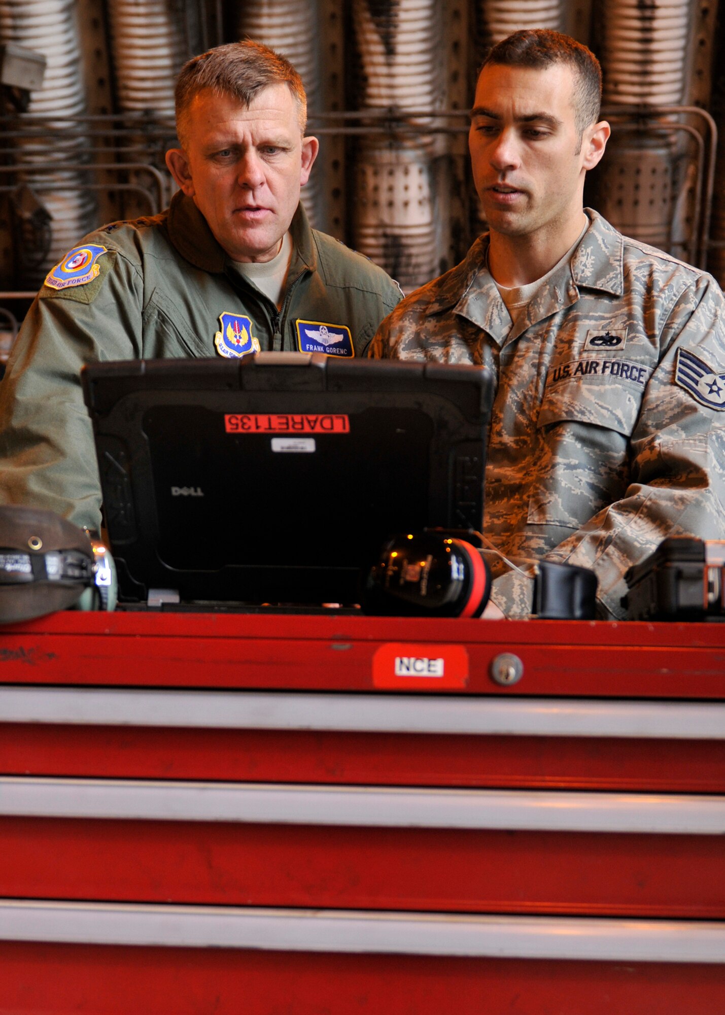 ROYAL AIR FORCE LAKENHEATH, England - Lt. Gen. Frank Gorenc, 3rd Air Force commander, watches as  Staff Sgt. Matthew Torres, 48th Aircraft Maintenance Squadron dedicated crew chief, explains the Interactive Electronic Technical Manuals on June 23, 2011.  General Gorenc visited multiple base facilities to see the 48th Fighter Wing mission up close and recognize Liberty Airmen. (U.S. Air Force photo/Senior Airman Tiffany M. Deuel)
 
