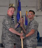 Lt. Col. Craig Punches accepts the 628th Logistics Readiness Squadron guidon from Col. Benjamin Wham during the 628 LRS Change of Command June 23 at Joint Base Charleston. Colonel Punches is the new 628 LRS commander and Colonel Wham is the 628th Mission Support Group commander. (U.S. Air Force photo/ Tech. Sgt. Robert Gibson) 

