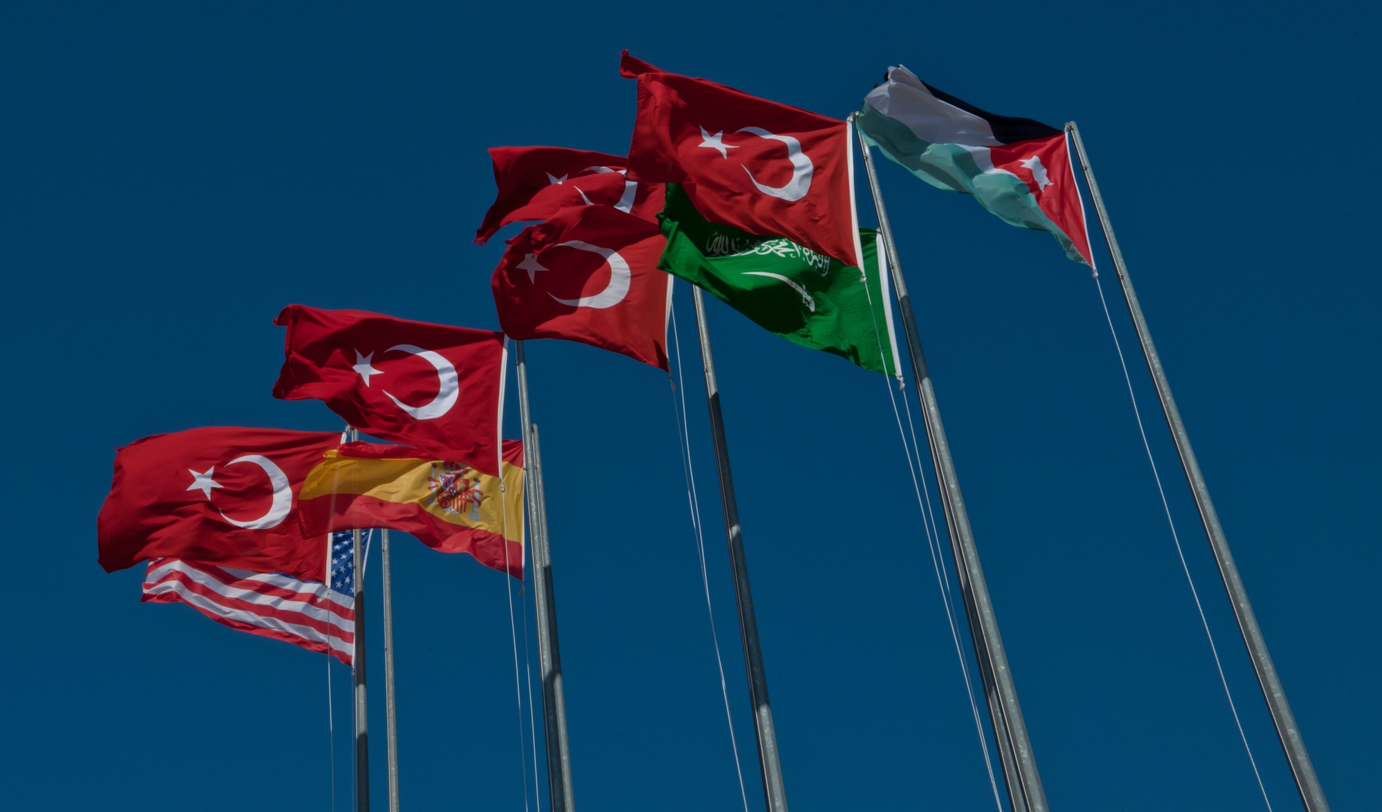 The flags of the participating nations in Anatolian Eagle 2011 are flown June 22, 2011, at Konya, Turkey.  Anatolian Eagle 2011 is a multi-national , large-force employment exercise involving a variety of military aircrafts ranging from attack, air superiority, refueling, and reconnaissance to interdiction. The purpose of the annual exercise is to provide a realistic, scenario-based training to test and evaluate aircraft combat readiness and manage tactical training progress. Service members from Turkey, Jordan, Saudi Arabia, Spain and the U.S. participated in AE-11. (U.S. Air Force photo by Staff Sgt. Alexandre Montes/Released)