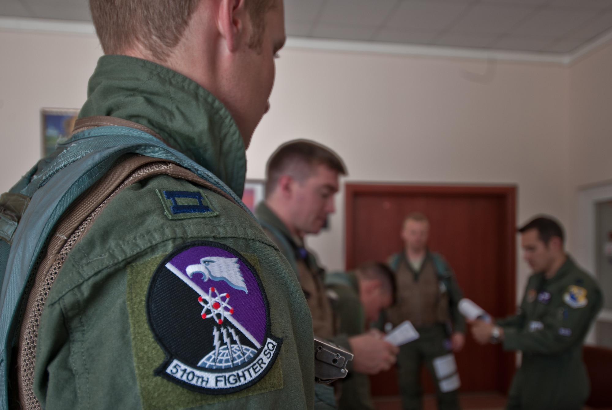 Pilots from the 501st Fighter Squadron at Aviano Air Base, Italy, attend a preflight briefing during Anatolian Eagle June 21, 2011, at 3rd Main Jet Base Konya, Turkey.  Anatolian Eagle 2011 is a multi-national , large-force employment exercise involving a variety of military aircrafts ranging from attack, air superiority, refueling, and reconnaissance to interdiction. The purpose of the annual exercise is to provide a realistic, scenario-based training to test and evaluate aircraft combat readiness and manage tactical training progress. Service members from Turkey, Jordan, Saudi Arabia, Spain and the U.S. participated in AE-11. (U.S. Air Force photo by Staff Sgt. Alexandre Montes/Released)