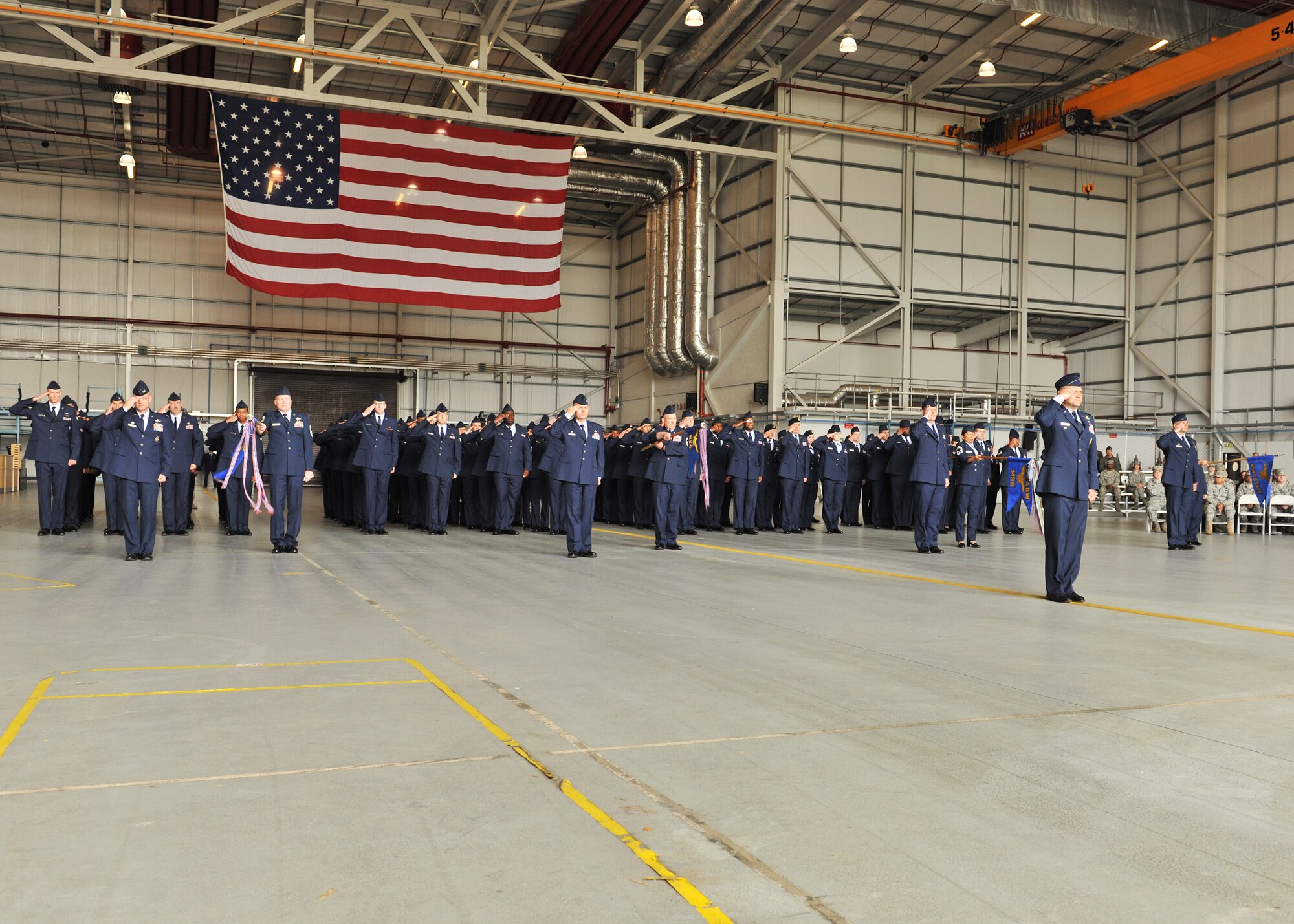 RAF MILDENHALL, England – The men and women of the 100th Air Refueling Wing present their first salute to Col. Christopher Kulas, 100th ARW incoming commander, June 24, 2011, during the wing change of command ceremony at Hangar 814. Colonel Kulas was formerly the 379th Expeditionary Operations Group commander, 379th Air Expeditionary Wing, Southwest Asia. Colonel Kulas was previously stationed at RAF Mildenhall as a pilot for the 351st Air Refueling Squadron from June 1992 to September 1996.  (U.S. Air Force photo/Senior Airman Tabitha M. Lee)