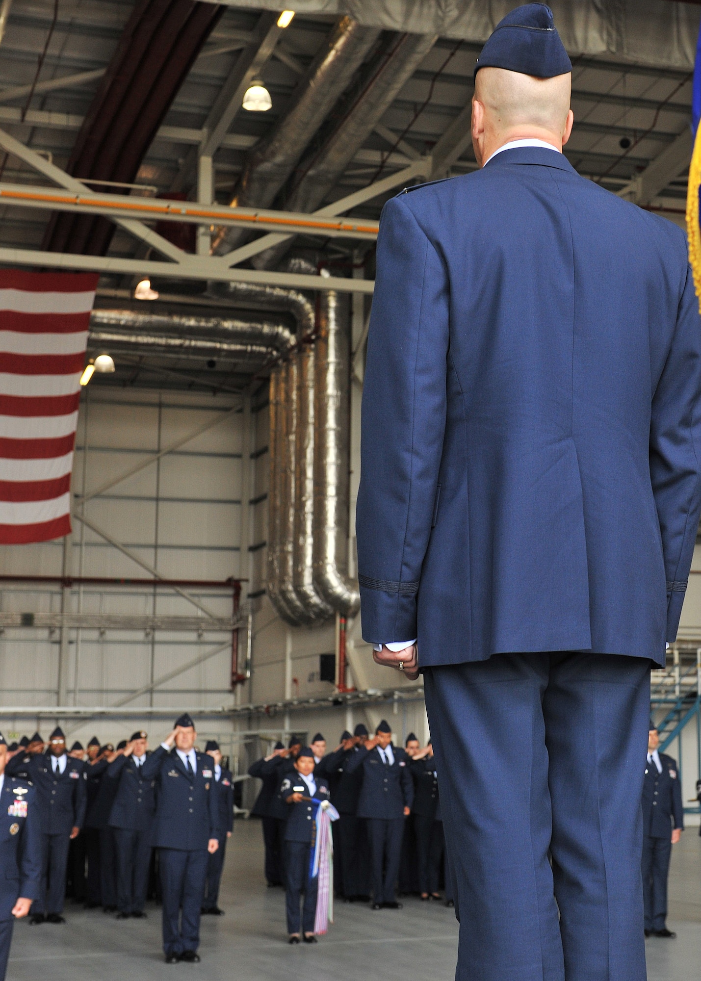 RAF MILDENHALL, England -- Col. Chad Manske, 100th Air Refueling Wing outgoing commander, receives his final salute as commander from members of the 100th ARW June 24, 2011, during the wing change command ceremony at Hangar 814. Colonel Manske will be going to New York City, N.Y. where he will take a position as a Military Fellow at the Council of Foreign Relations.  Only one person from each branch of the military service earns a place for this prestigious position each year.  (U.S. Air Force photo/Senior Airman Tabitha M. Lee)