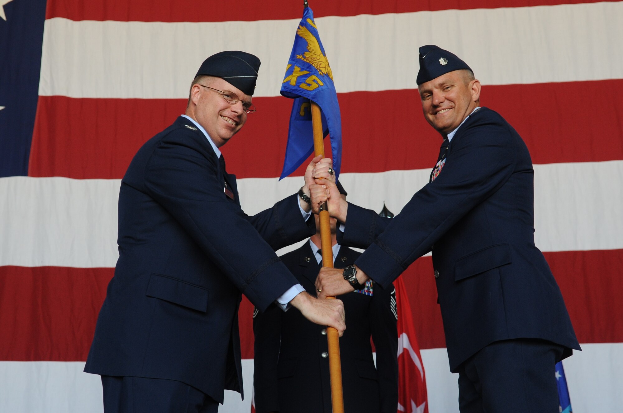 Lt. Col. Mark Bowen, right, accepts command of the 39th Maintenance Squadron from Col. Eric Beene, 39th Air Base Wing commander, during the change-of-command ceremony June 24, 2011, at Incirlik Air Base, Turkey. (U.S. Air Force photo by Airman 1st Class Clayton Lenhardt/Released)
