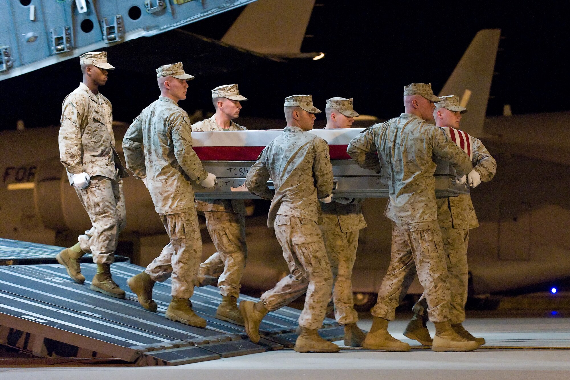 A U.S. Marine Corps carry team transfers the remains of Marine Lance Cpl. Jared C. Verbeek, of Visalia, Calif., at Dover Air Force Base, Del., June 23, 2011. Verbeek was assigned to the 1st Battalion, 5th Marine Regiment, 1st Marine Division, Camp Pendleton, Calif. (U.S. Air Force photo/Roland Balik)