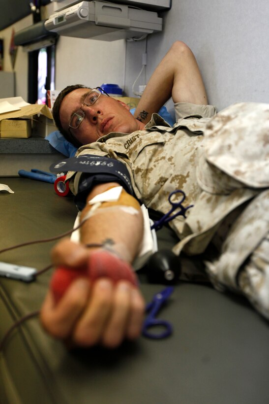 Sgt. Jeremy Crist with 2nd Battalion, 14th Regiment, donates blood at a Red Cross Blood drive. The blood drive was part of Special Purpose Marine Air Ground Task Force Marine Week St. Louis, giving Marines an opportunity to increase public awareness of the Marine Corps' value to our nation's defense and to preserve and mature the Corps' relationship with the American people.