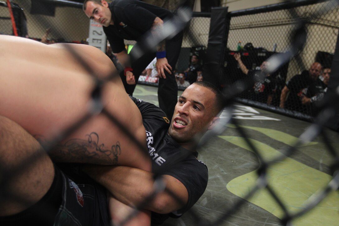 Edwin Nuez attempts to choke out his opponent to bring a quick end to his match during the USA National Pankration Championships in Las Vegas June 25, 2011.::r::::n::