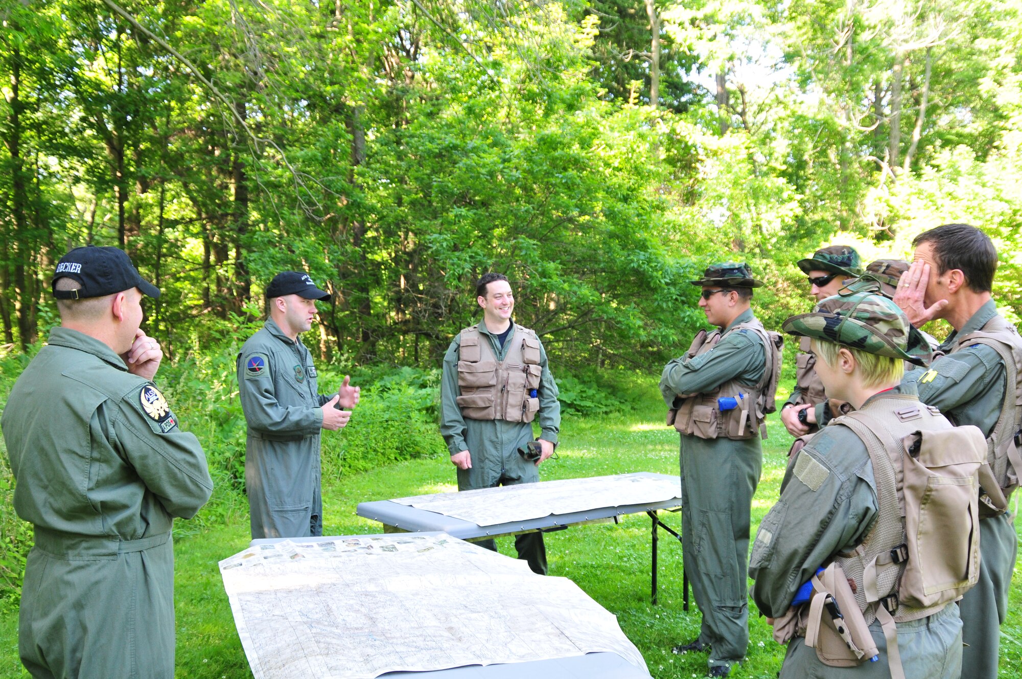 MILWAUKEE--Three members of the 128th Air Refueling Wing's Life Support shop instruct several 128th Air Refueling Wing aircrew personnel in the use of land navigation techniques during an annual training event on Saturday, June 25, 2011.  The annual training event covered various aspects of an aircrew's ability to survive in adverse situations.  (U.S. Air Force photo by Master Sgt. Kenneth Pagel / Released)