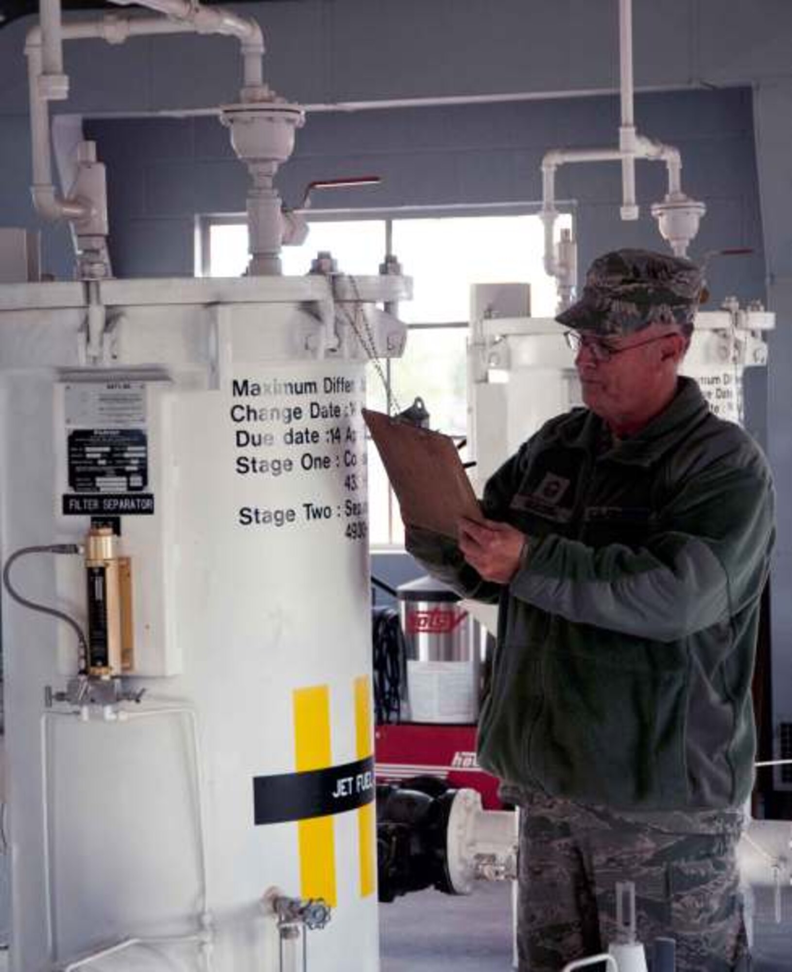 Senior Master Sgt. Cal Garlock, Fuels Superintendent, checks the separators that ensure that the jet fuel is free of contaminants, sediment, and water before it reaches the fuel trucks and the aircraft June 9. (U.S. Air Force Photo by Tech. Sgt. Heather Walsh)
