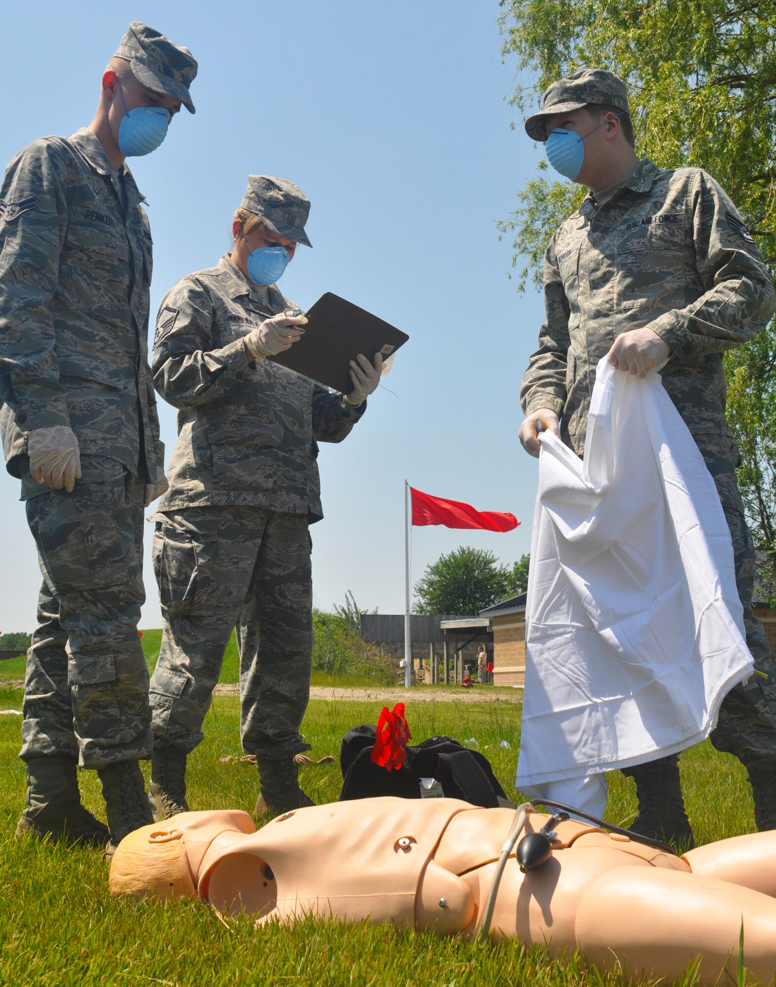 Airman Steven Penkert and Staff Sgt. Matthew Bohlen, both assigned to the 128th Air Refueling Wing Force Support Squadron, recover a simulated corpse during a Search and Recovery training exercise at Gen. Mitchell International Airport on Sunday, June 26, 2011.  The training program is an annual event that prepares Airmen for their roles as members of the Search and Recovery Team, which is responsible for recovering deceased service members at incident sites; the team is led by the mortuary affairs officer.  (U.S. Air Force photo by Staff Sgt. Jeremy Wilson / Released)  