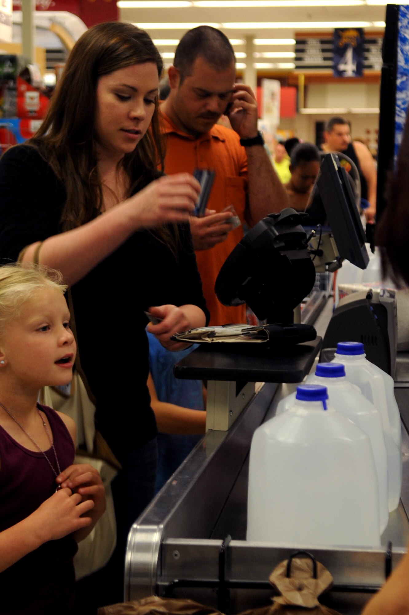 MINOT AIR FORCE BASE, N.D. -- A crowd of people rush to the commissary to buy water after hearing news of possible water contamination in the area here June 25. The commissary has distributed approximately 1500 gallons of water since the frenzy began and inventory levels have been elevated to meet the demand. (U.S. Air Force photo/Senior Airman Aaron-Forrest Wainwright)
