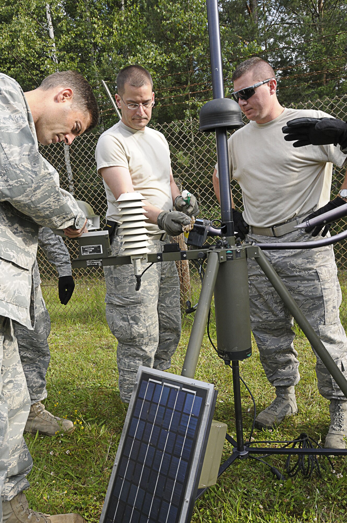 Personnel from the 7th Weather Squadron assemble a tactical metrological observation system during Allied Strike 2011 at Grafenwoehr Training Area, Germany, June 24, 2011. Allied Strike is Europe’s premier Close Air Support exercise, held annually to conduct robust, realistic CAS training that helps build partnership capacity among Allied NATO nations and refine the latest operational CAS tactics. (U.S. Air Force photo by Airman 1st Class Desiree W. Esposito)