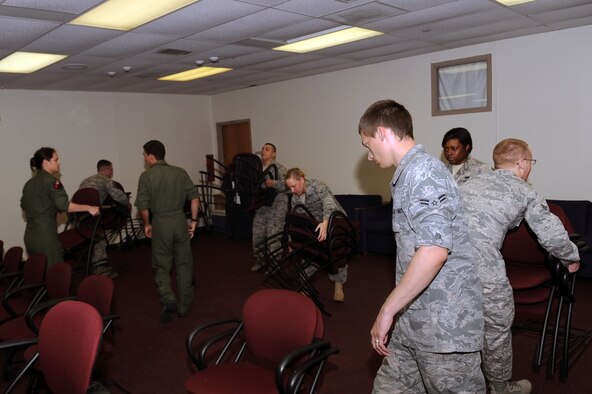 MINOT AIR FORCE BASE, N.D. -- Airmen from various squadrons volunteer their time to help organize accommodation rooms at the emergency shelter here June 25. Among one of the actions taken by Air Force Global Strike Command’s MAFB to help support displaced families affected by the flooding situation in Minot, was offer emergency shelter and facility services to all displaced DoD personnel here. (U.S. Air Force photo/Senior Airman Aaron Forrest Wainwright)
