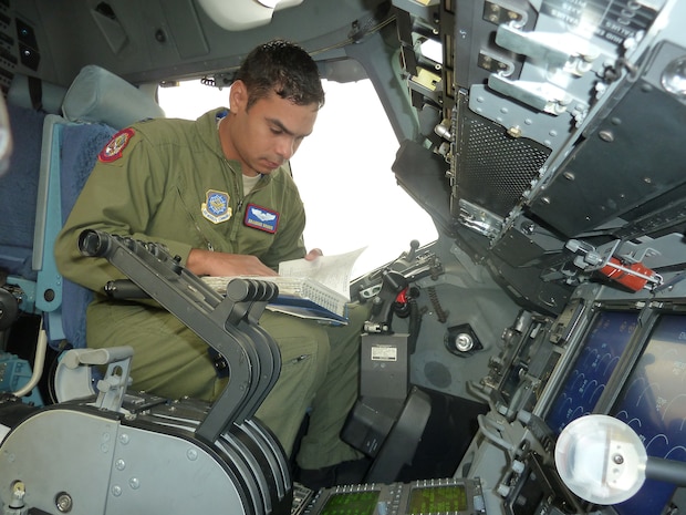 Capt. Brandon Brown, 15th Airlift Squadron from Joint Base Charleston, S.C., conducts a pre-flight check on the C-17 Globemaster III at the 49th International Paris Air Show. Captain Brown was the aircraft commander for a media flight during the show. (U.S. Air Force photo/Tech. Sgt. Francesca Popp)