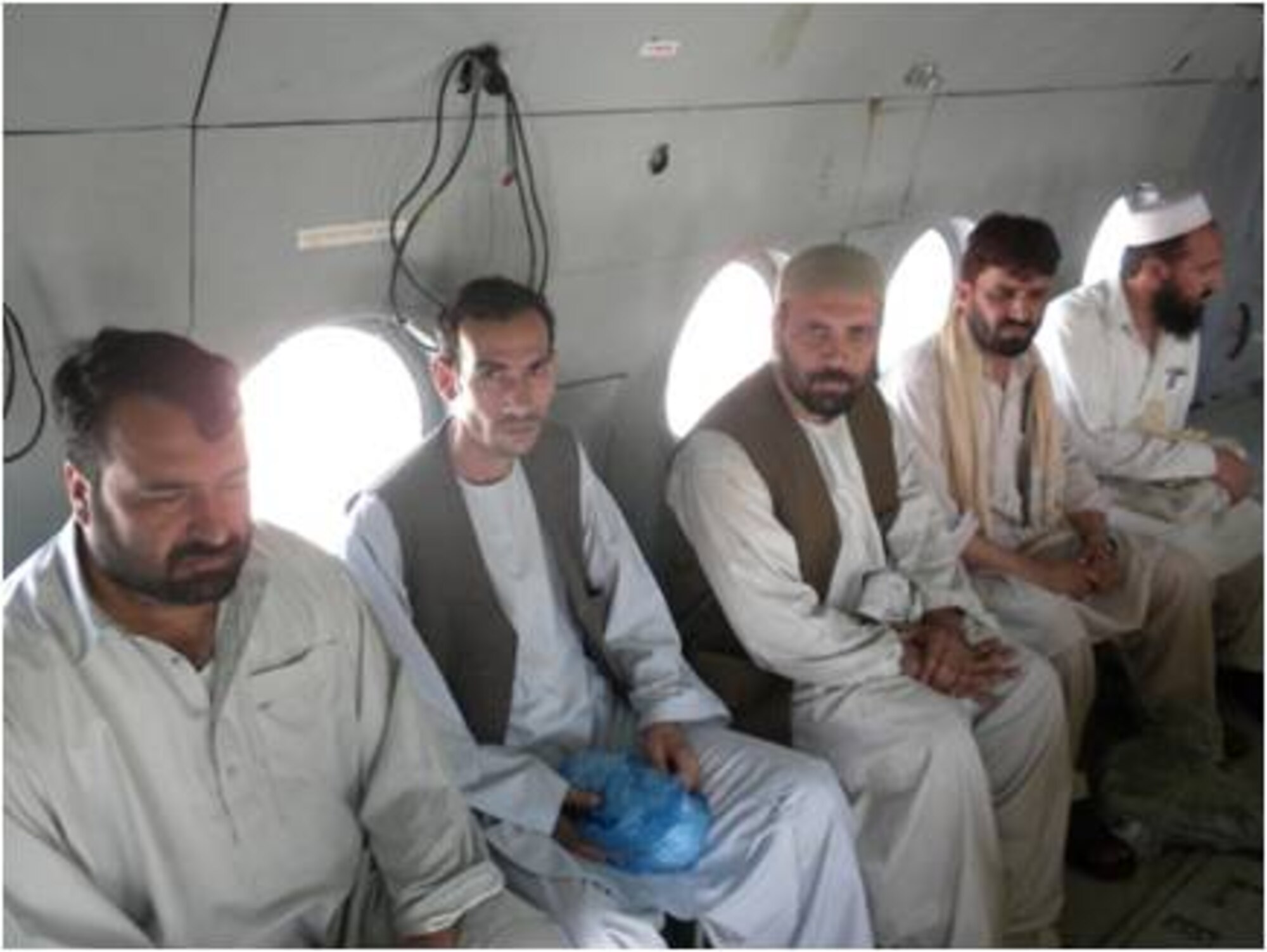 6/19/2011 – KANDAHAR, Afghanistan – Doctors from the Afghan Health Development Services are transported on an Mi-17 recently.  Members of the AAF and 738th Air Expeditionary Advisory Group transported the five physicians, medical supplies and chlorine to the remote district of Ma’ruf in support of a cholera outbreak recently.  (U.S. Air Force courtesy photo)