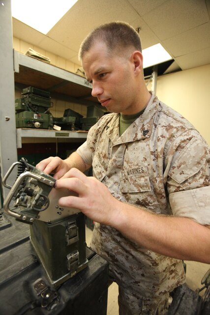 Cpl. Donald L. Gronlund, a radio technician with Marine Wing Communications Squadron 28, does his job as he is highlighted for the Cherry Point Windsock flyby.