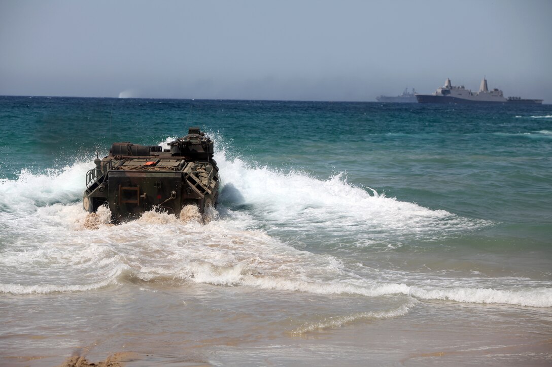 Staff Sgt. Jose Sahagun visits with Iwo Jima veteran Charles Ranger, June 13. Ranger is a former Marine who earned a Purple Heart while serving as a machine gunner during the initial push of the historic battle.