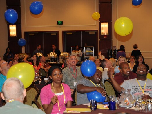 AUSTIN, Texas—Reservists at the Air Force Reserve Command’s South Region Yellow Ribbon Program in Austin try to keep balloons from hitting the ground June 25, 2011. The balloons represented the many different aspects of life reservists must juggle with the help of a wingman. (U.S. Air Force photo/Staff Sgt. Anna-Marie Wyant)