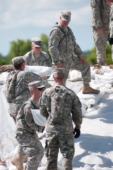 Soldiers with the 1-129th Field Artillery Regiment, and the 1128th Forward Support Company, Missouri National Guard, lay sandbags at the Oregon Water Treatment Plant in Forest City, Mo., on June 27, 2011.(U.S. Air Force photo by Senior Airman Sheldon Thompson)