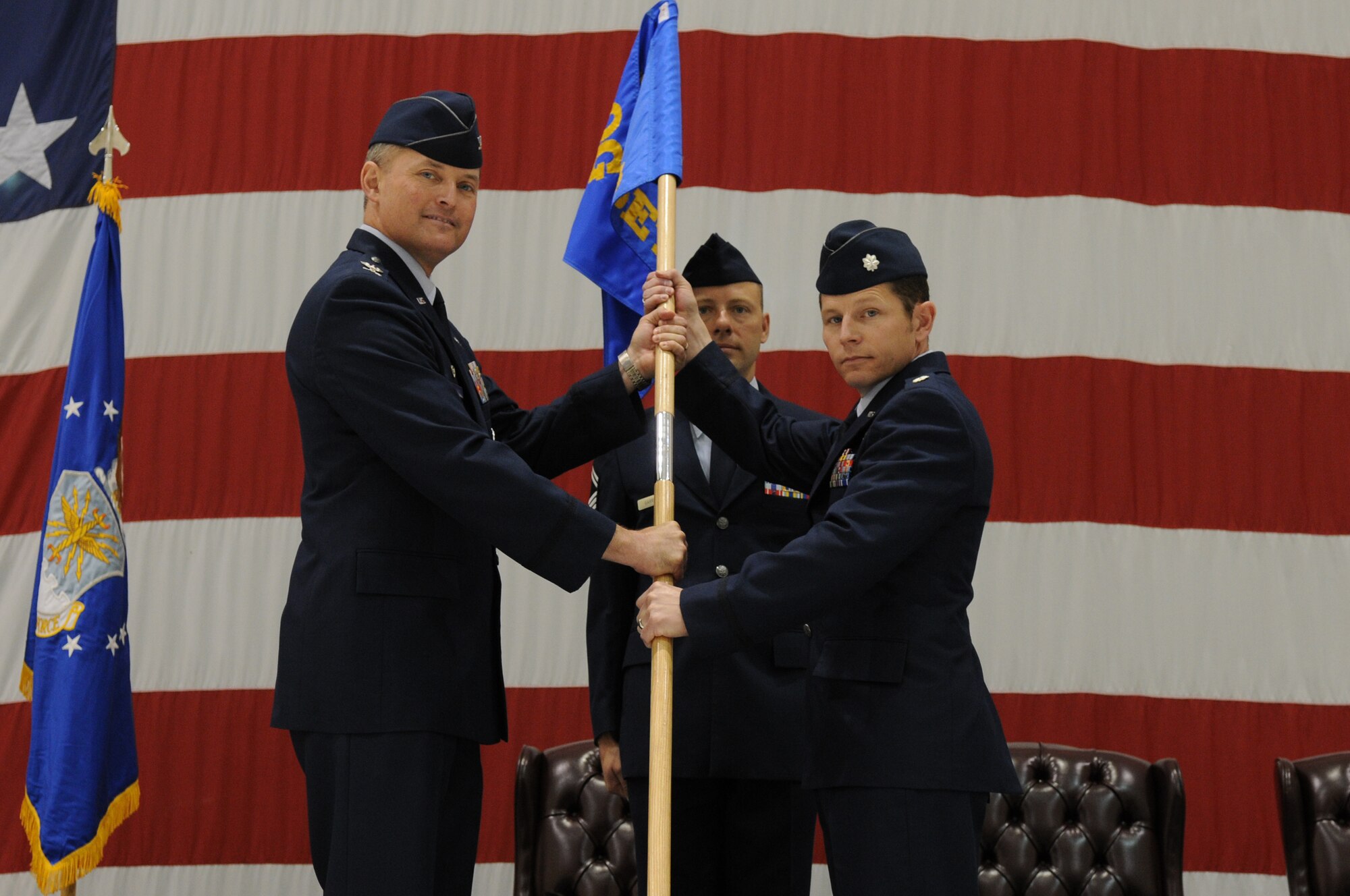 Colonel Lawrence Hoffman (left), 9th Operations Group commander passes the Detachment 3 guidon to Lt. Col. Raymond Simmons (right), newly appointed Detachment 3 commander during a change of command ceremony here, June 20.(U.S. Air Force photo/ Senior Airman Carlin Leslie)
