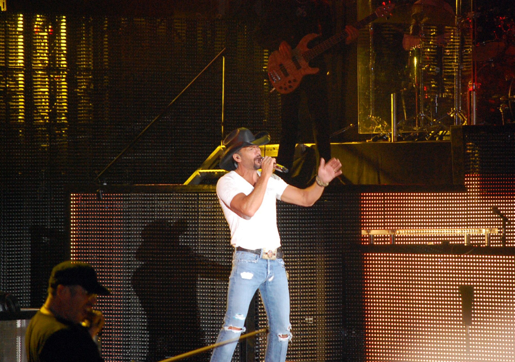 Country music singer Tim McGraw entertains a crowd of fans at the George Ampitheater in George, Wash., on June 18. Reservists from the 446th Airlift Wing attended the concert for free as part of the Get 1 Now program. (U.S.Air Force photo by 2nd Lt. Denise Hauser)