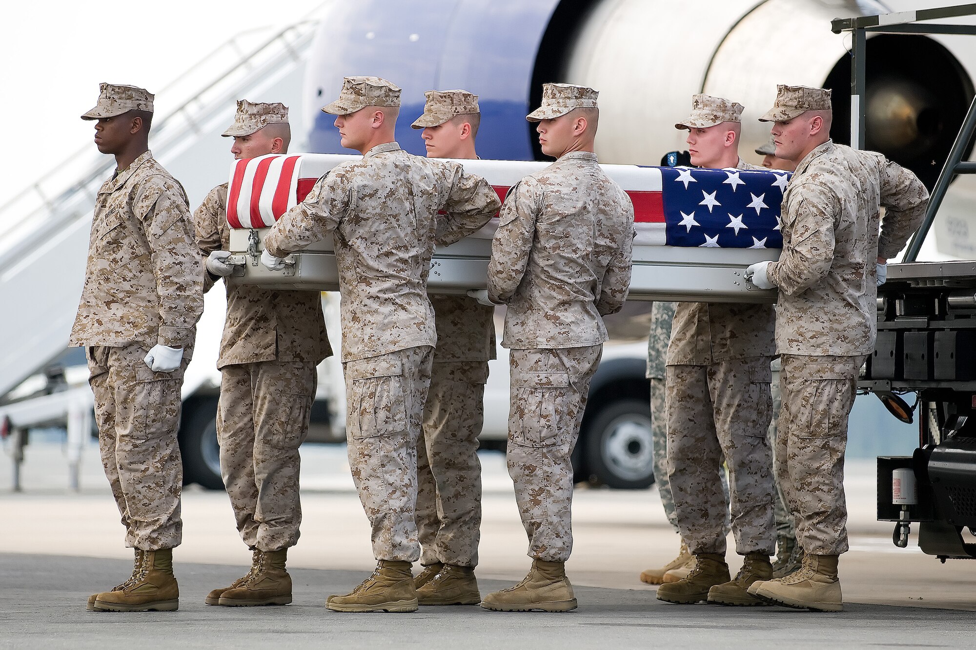 A U.S. Marine Corps carry team transfers the remains of Marine Sgt. Marlon E. Myrie, of Oakland Park, Fla., at Dover Air Force Base, Del., June 27, 2011. Myrie was assigned to the 12nd Battalion, 8th Marine Regiment, 2nd Marine Division, Camp Lejeune, N.C. (U.S. Air Force photo/Adrian Rowan)